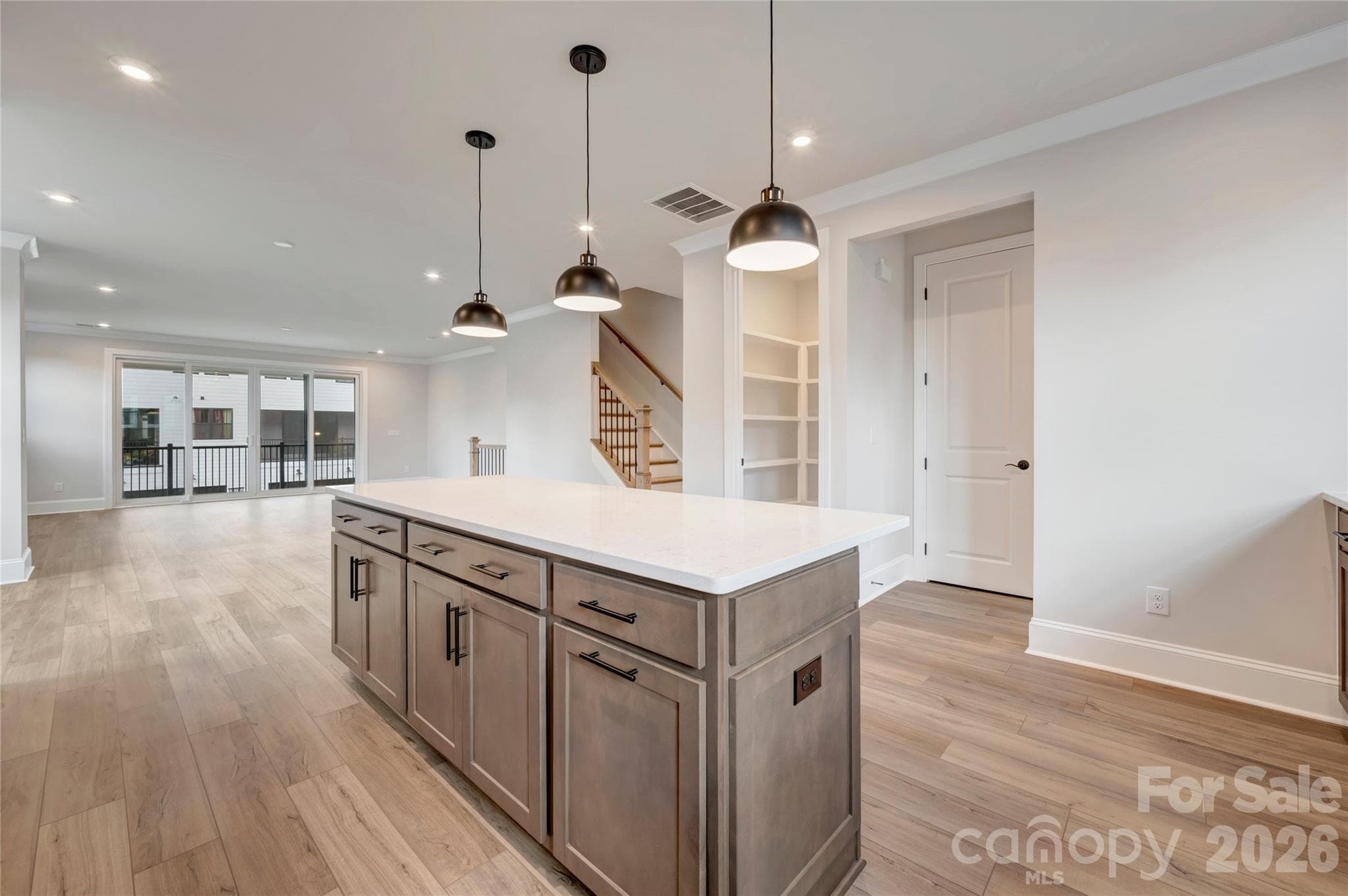 Gourmet kitchen with built-in wood shelving in the walk-in pantry - 13023 Lucy Park Lane, Charlotte