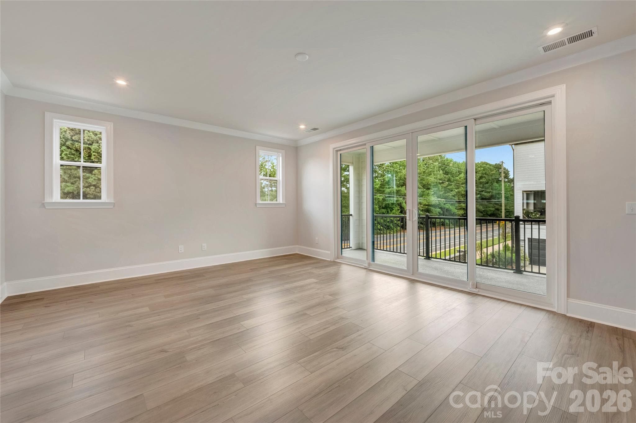 Living room space with access to the covered outdoor living space - 13023 Lucy Park Lane, Charlotte