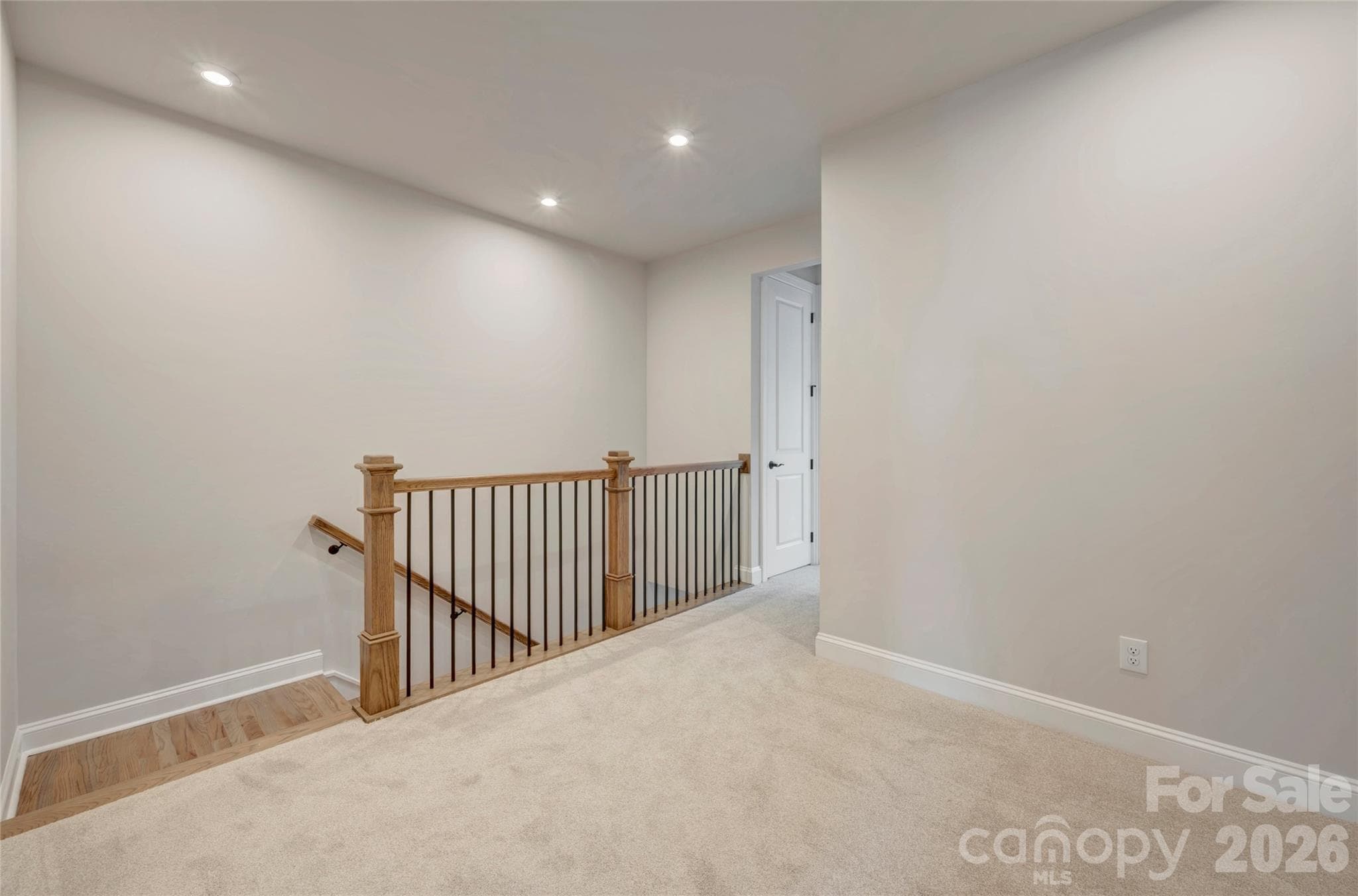 Third floor landing with open rails on the stairs - 13023 Lucy Park Lane, Charlotte