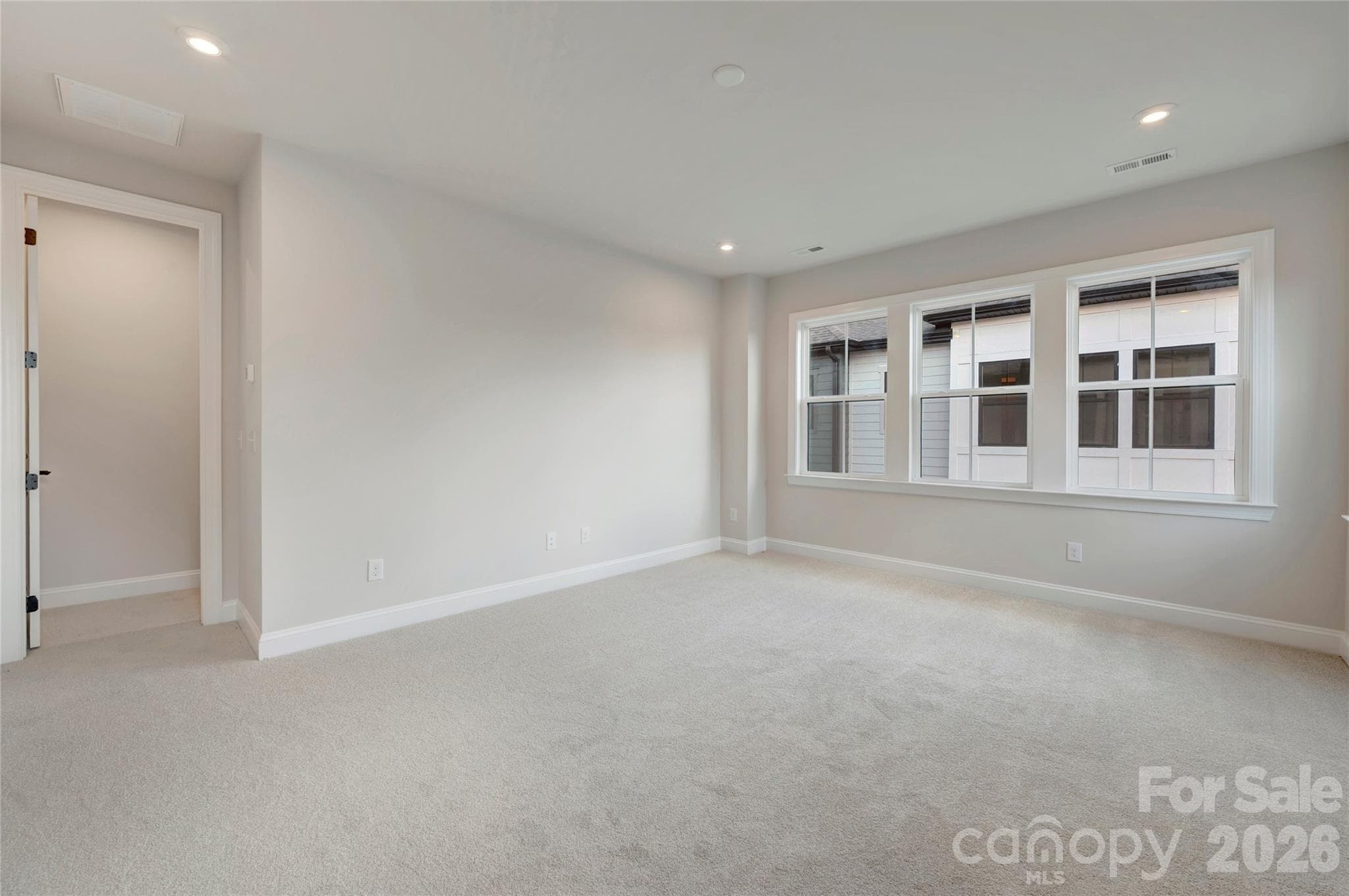 Light filled primary bedroom - 13023 Lucy Park Lane, Charlotte