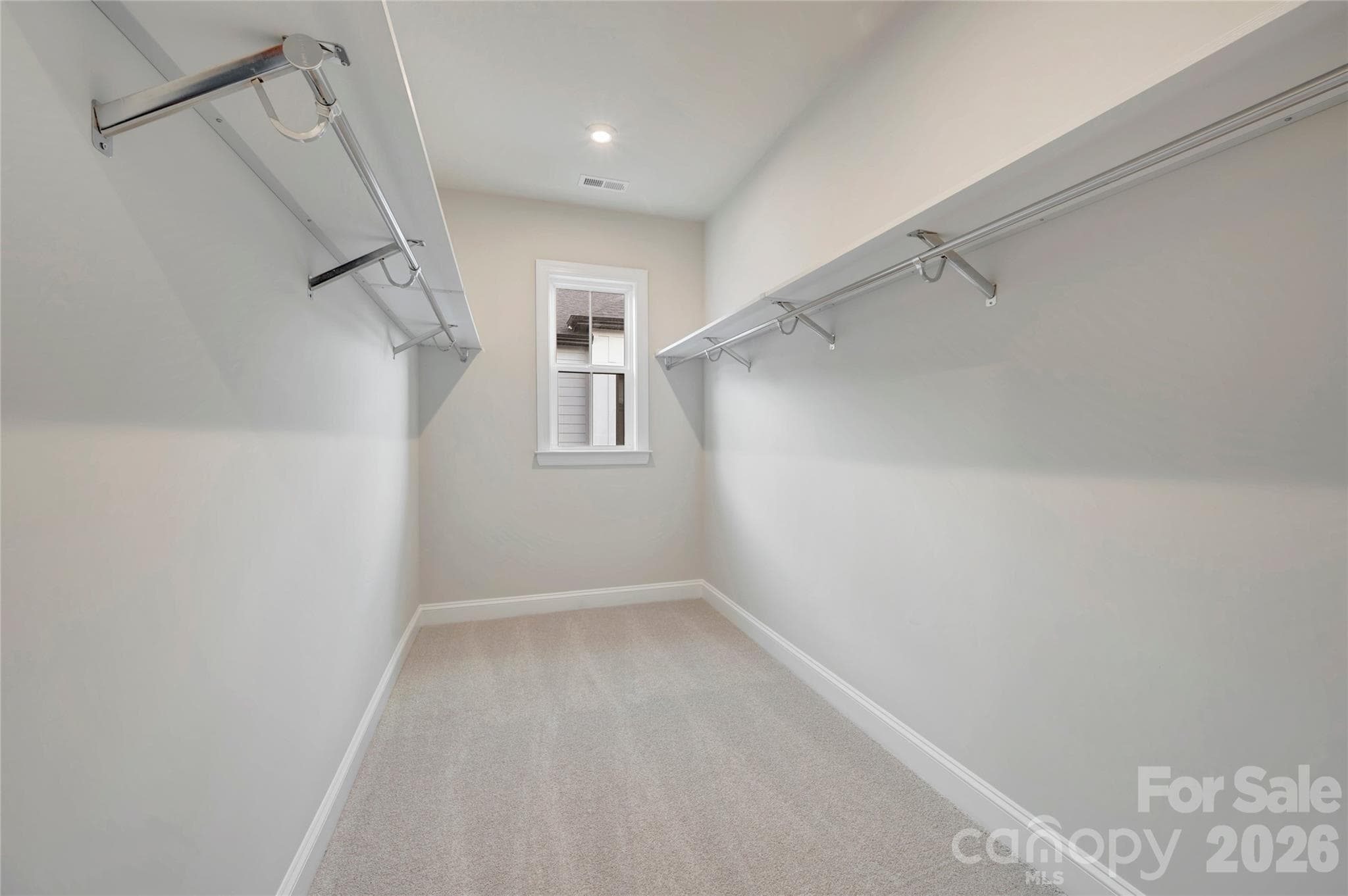 Primary walk-in closet with window - 13023 Lucy Park Lane, Charlotte