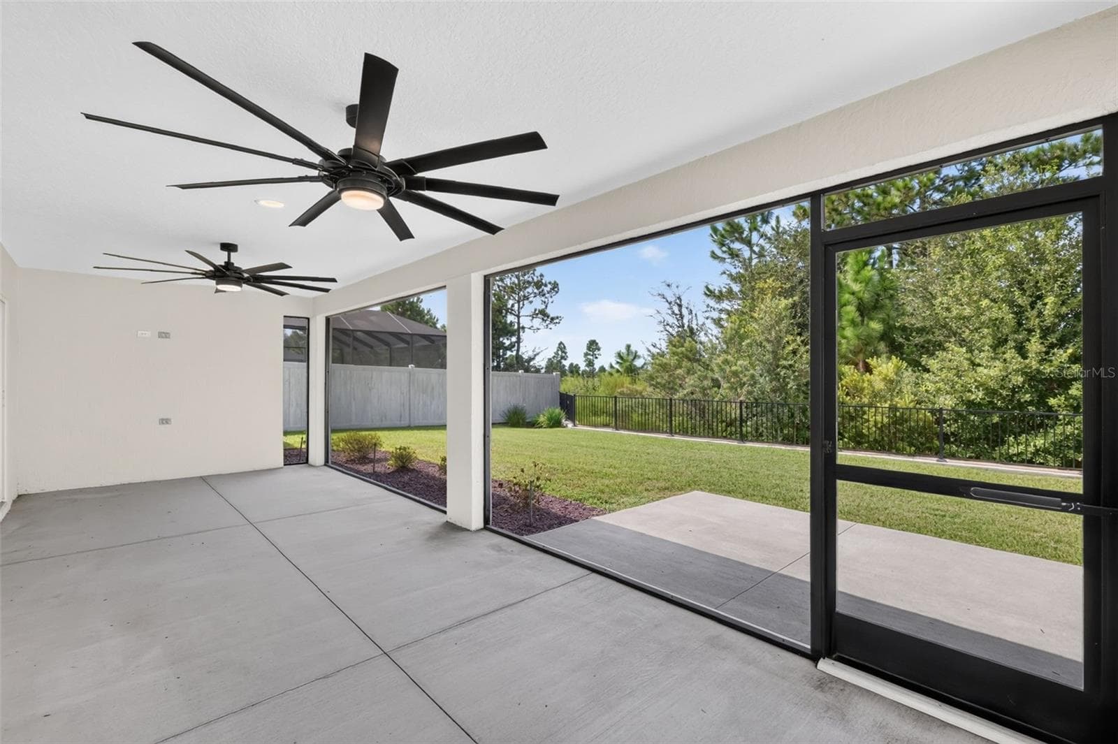 Expansive 28'x11' Lanai with Serene Eagle Preserve Views and PRIVACY Fencing - 7778 BRIAN ETHEREDGE WAY, THE VILLAGES