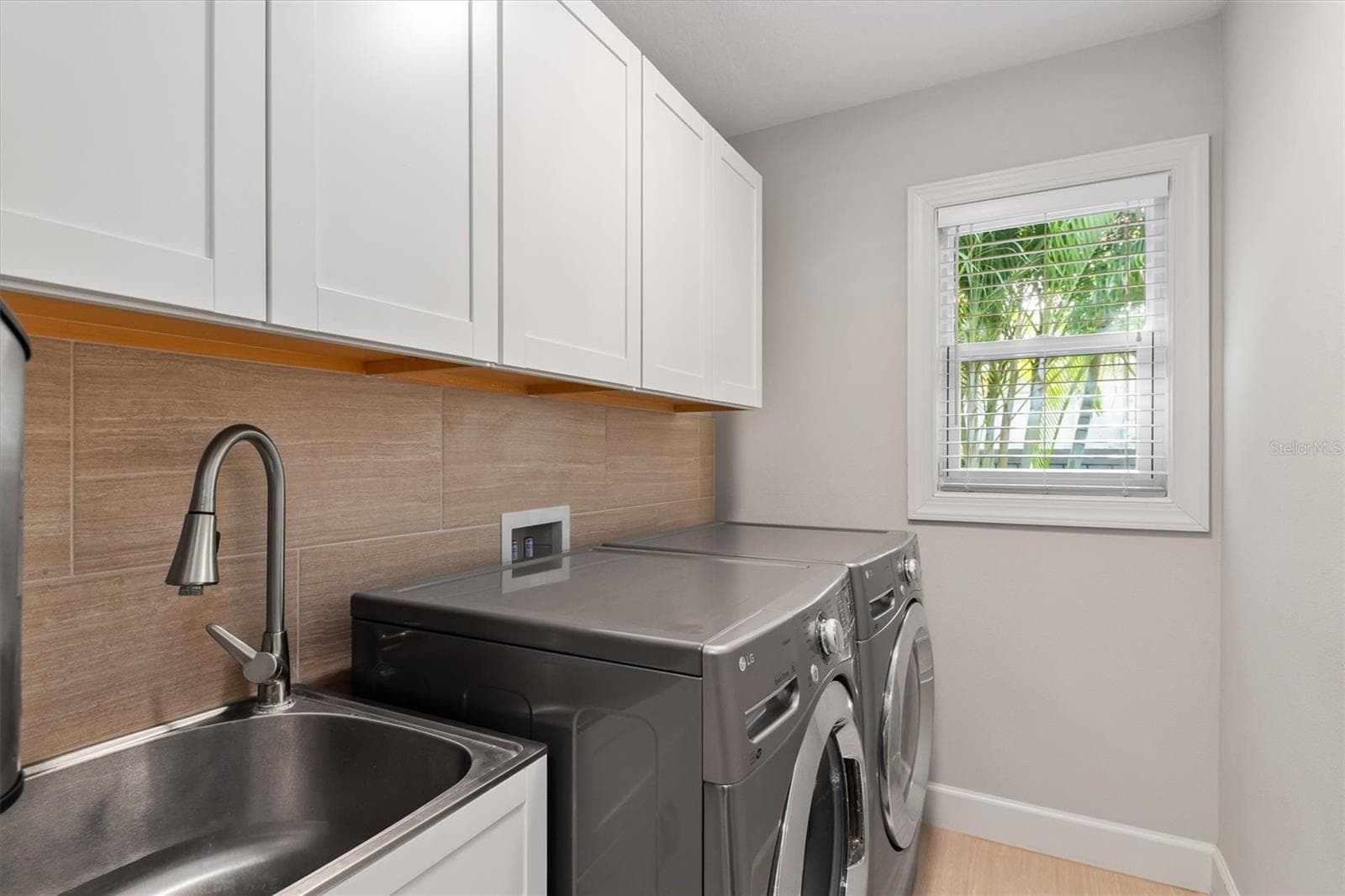 Inside laundry, wet sink and cabinets above it - 2420 SHEILA LN, NORTH PORT
