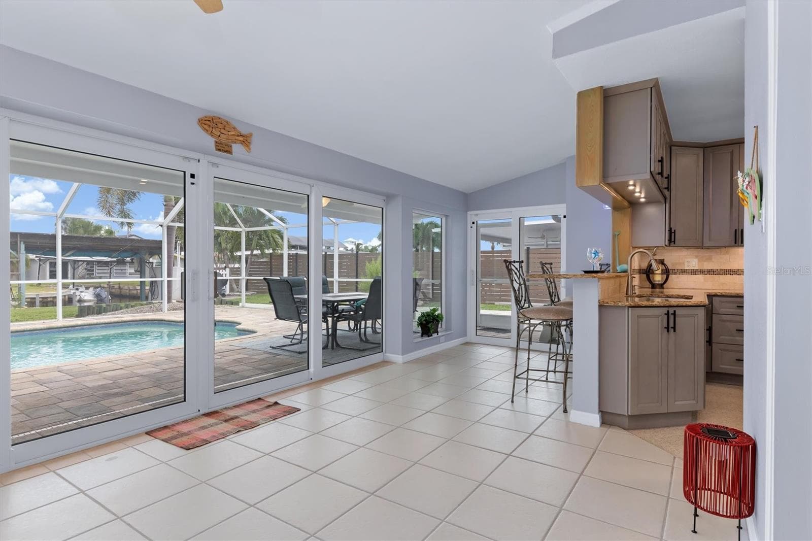 Florida room (1/2) with impact slider wall for amazing views - 1433 LEMON BAY DR, ENGLEWOOD