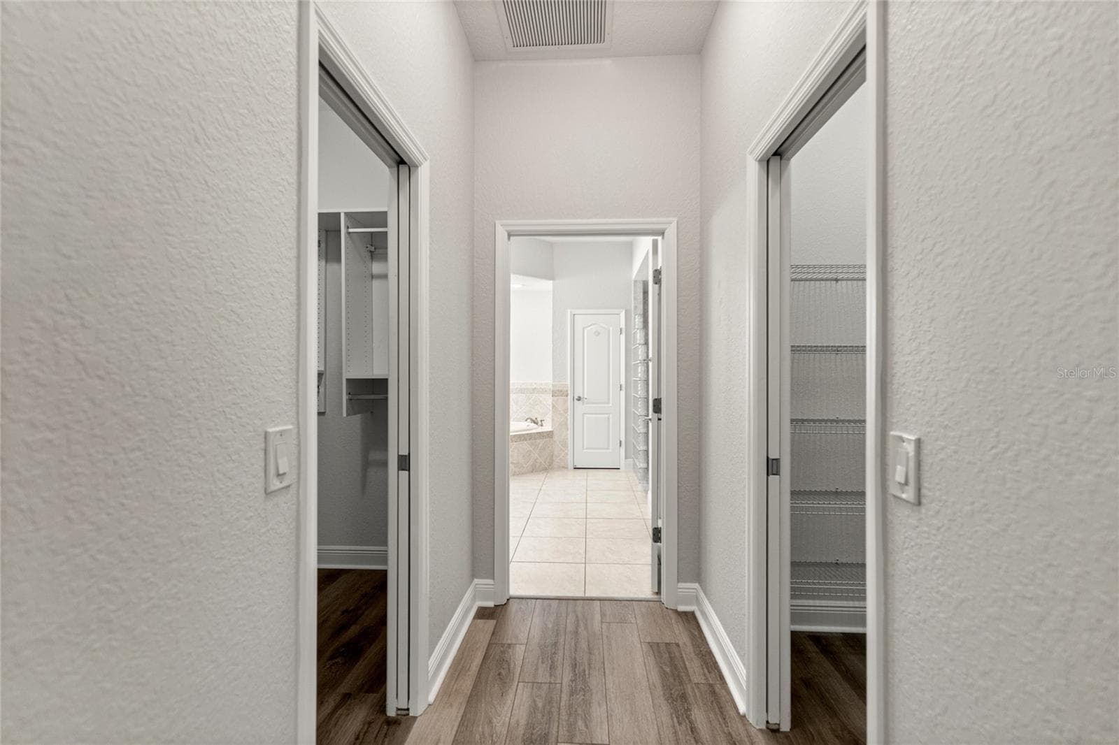Hallway master closets. - 1126 MIONA SHORES DR, THE VILLAGES
