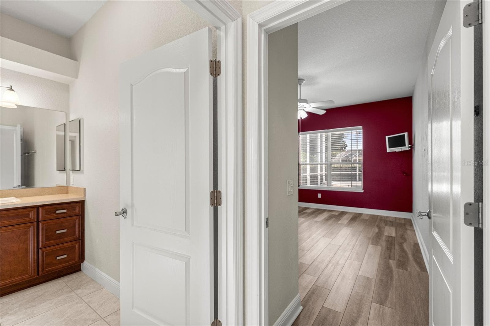 Hallway to guest bathroom/bedroom/office. - 1126 MIONA SHORES DR, THE VILLAGES