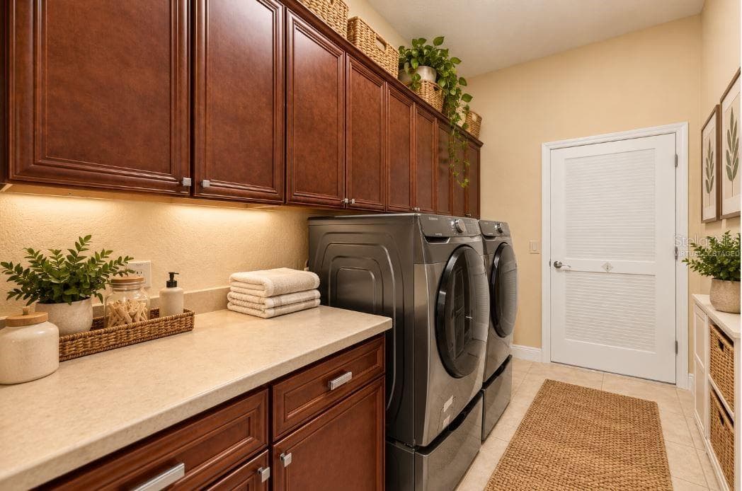 Virtually staged Indoor Laundry Room with Custom Cabinetry, Utility Sink, and Folding Counter. - 1126 MIONA SHORES DR, THE VILLAGES