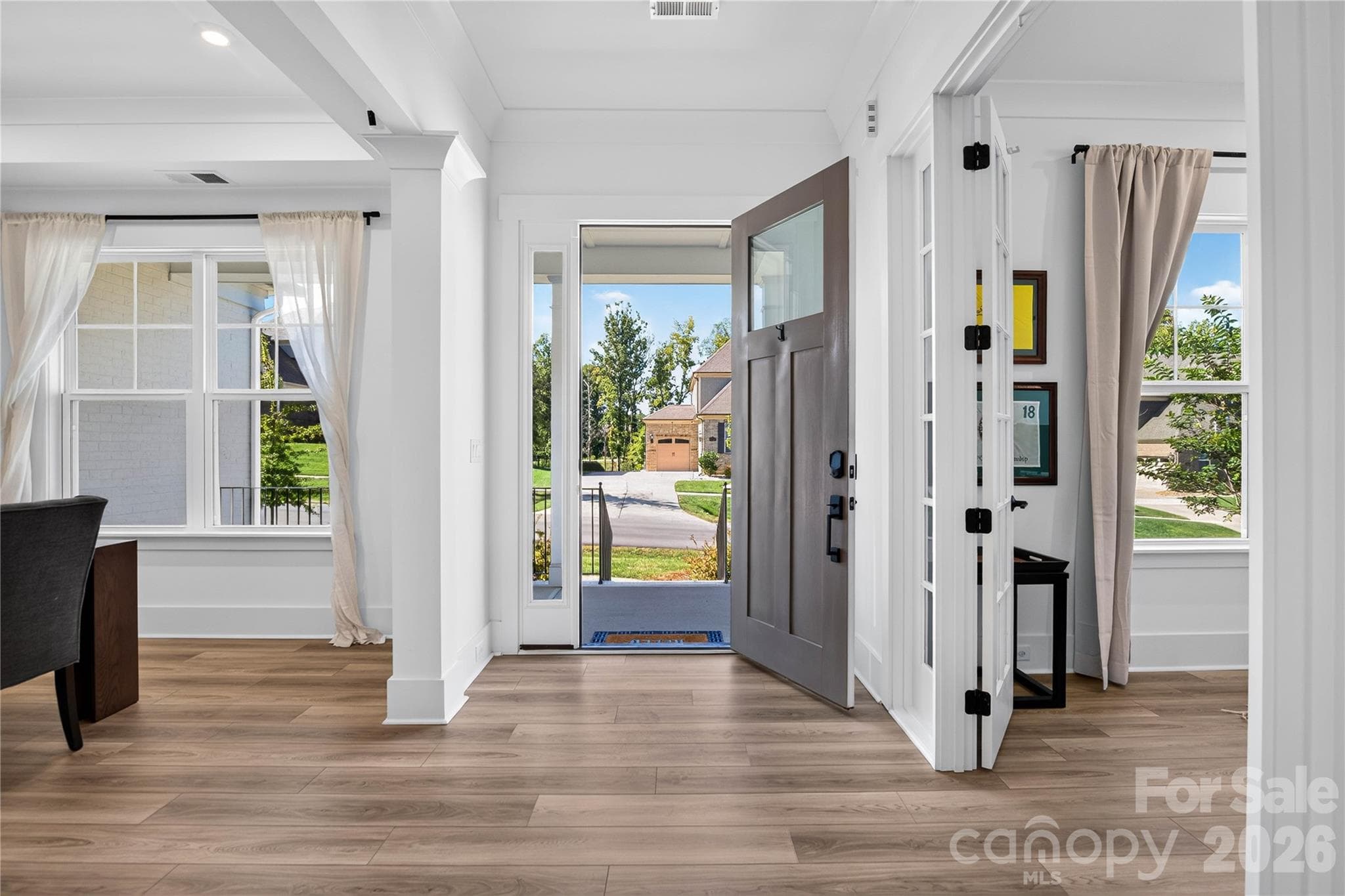 The soaring entrance foyer sets the tone for the elegance that waits in every room. - 1216 Glade Arch Lane, Huntersville