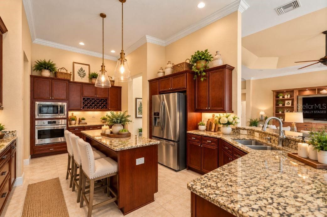 Virtually staged a gourmet kitchen. - 1126 MIONA SHORES DR, THE VILLAGES