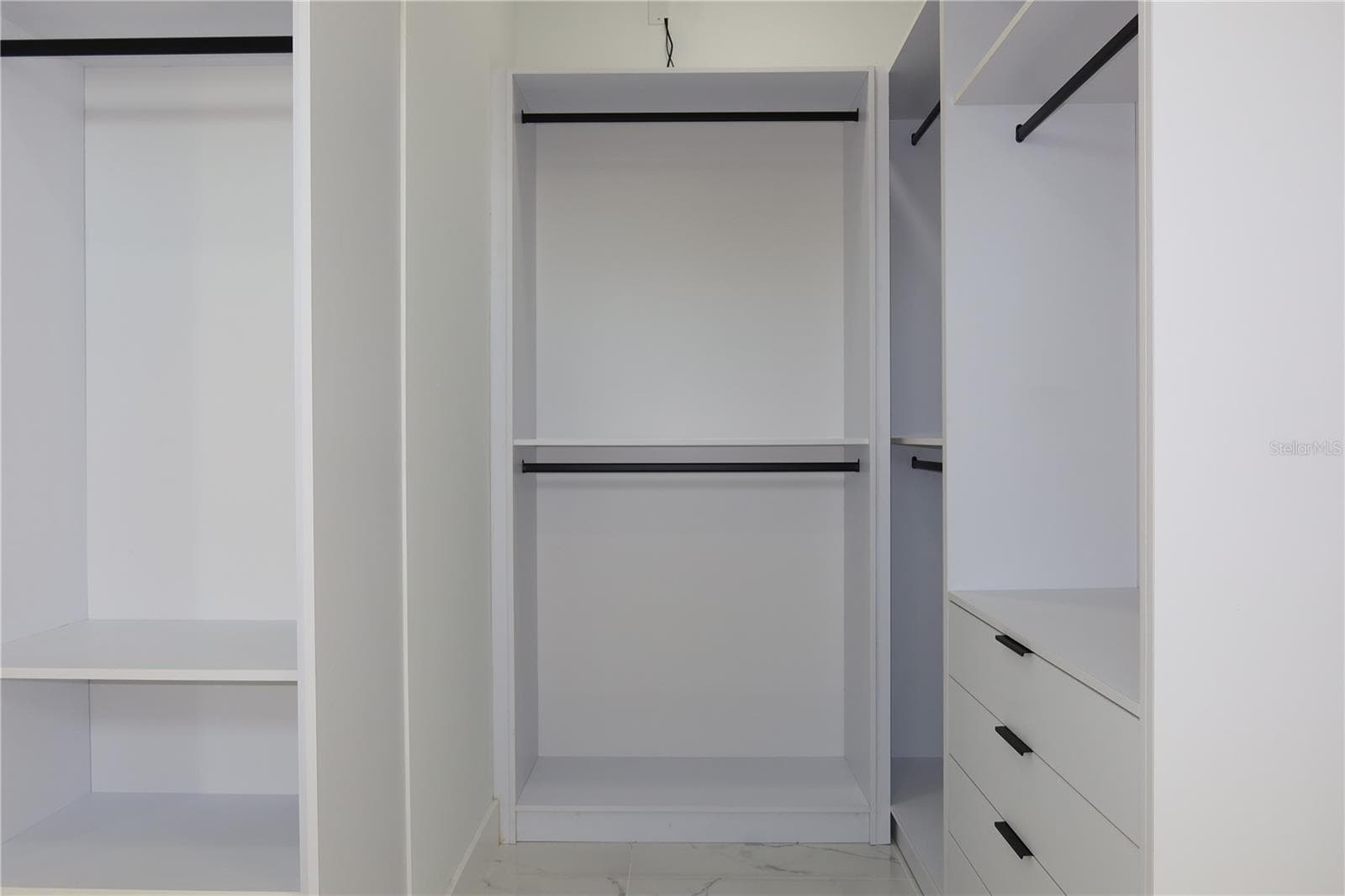 Walk in closet - primary bedroom - 151 BLAZING STAR AVE, LAKE ALFRED