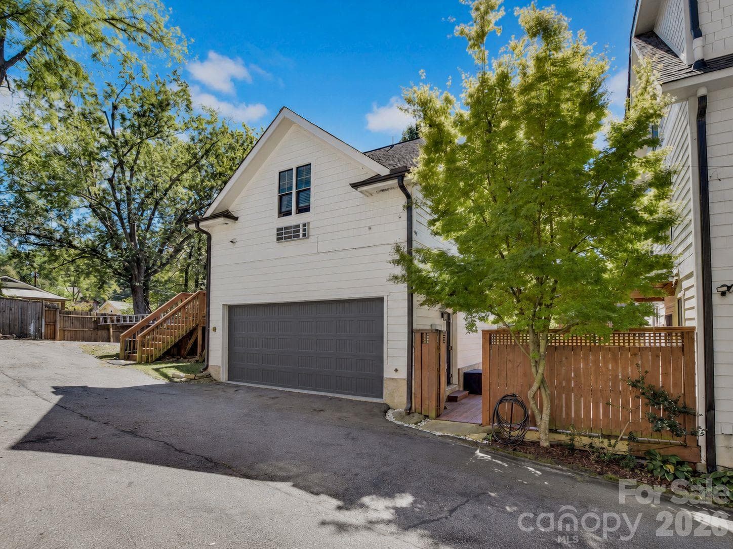 2-car garage offers plenty of storage and keeps your car nice and warm in the winter months - 92 Rumbough Place, Asheville