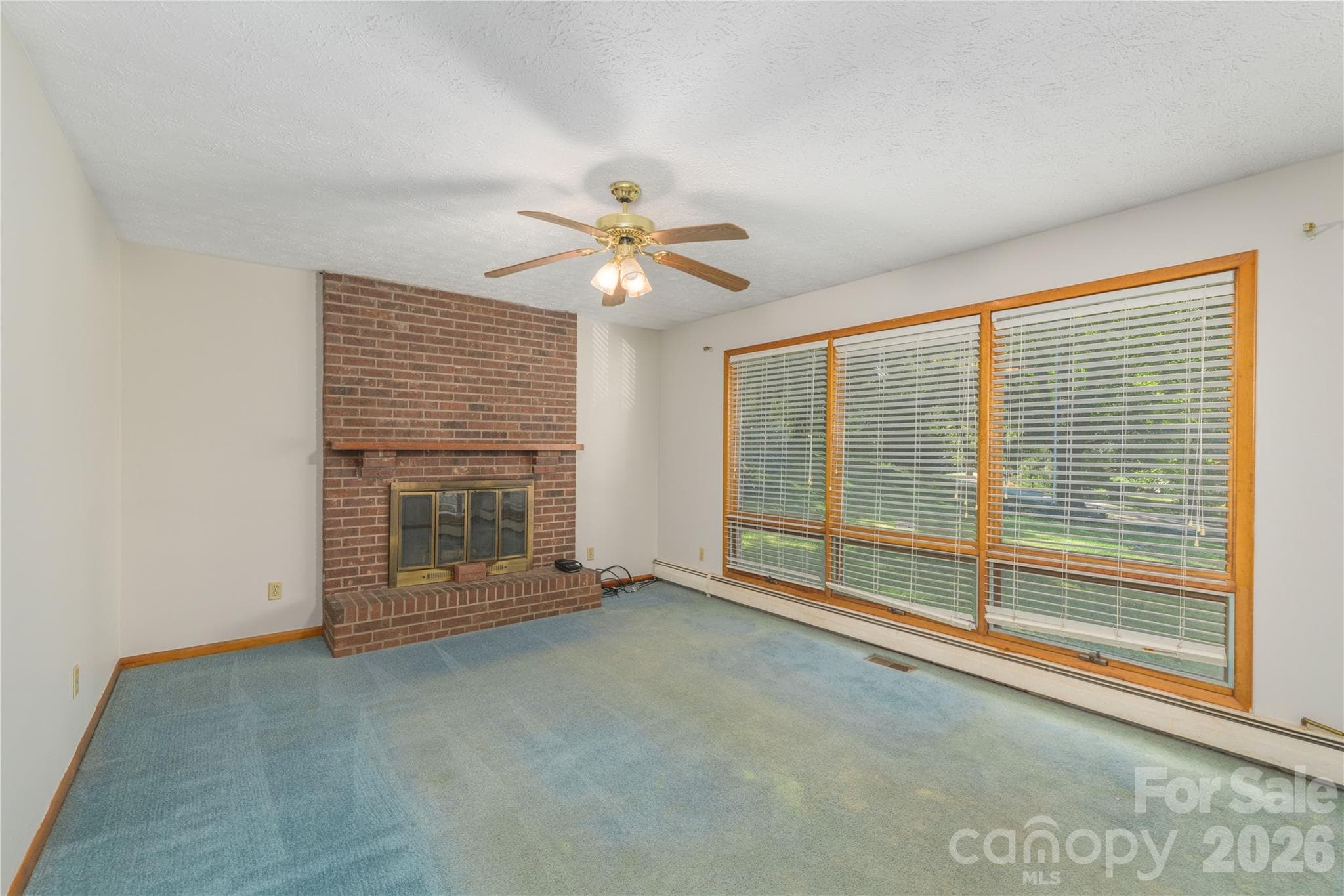 Living Room with Wood Fireplace - 2882 Butler Bridge Road, Mills River