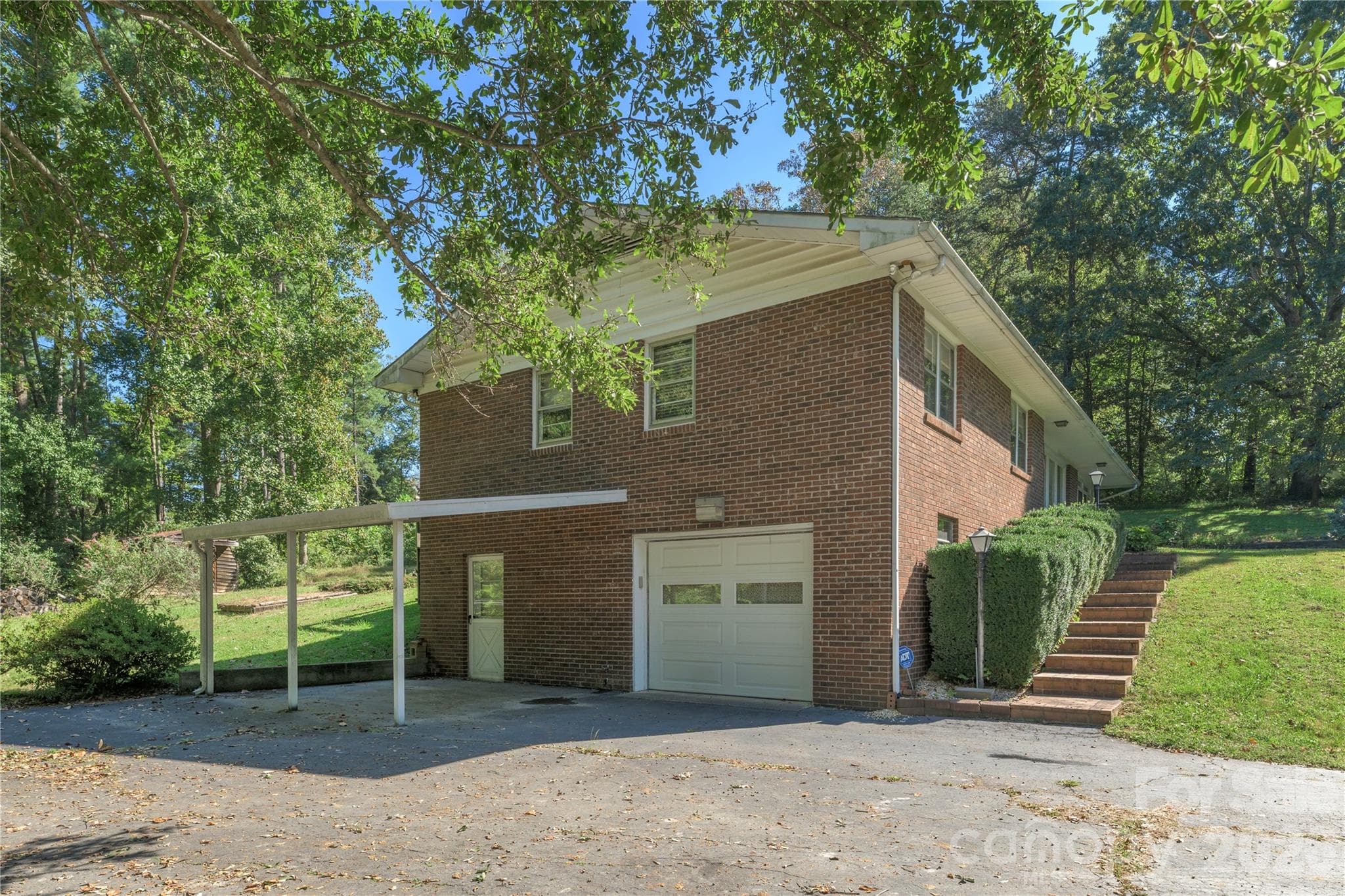 One Garage Door access in Basement--easy tandem parking plus a carport - 2882 Butler Bridge Road, Mills River