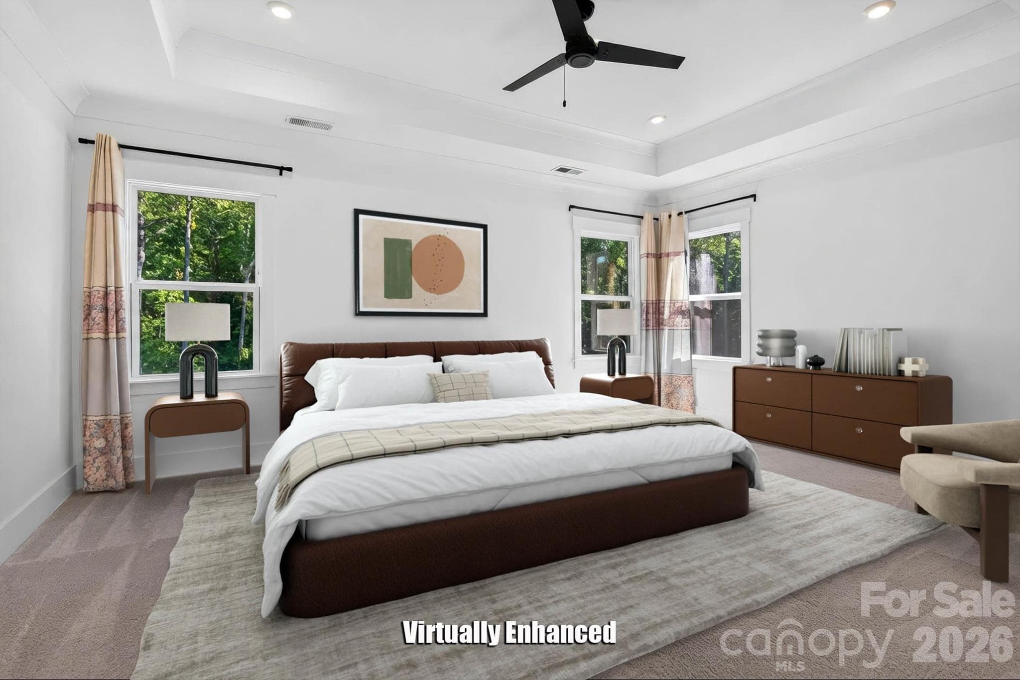 Wake up to treetops. The tray ceiling, oversized windows, and quiet morning light... (Virtually Staged) - 1216 Glade Arch Lane, Huntersville
