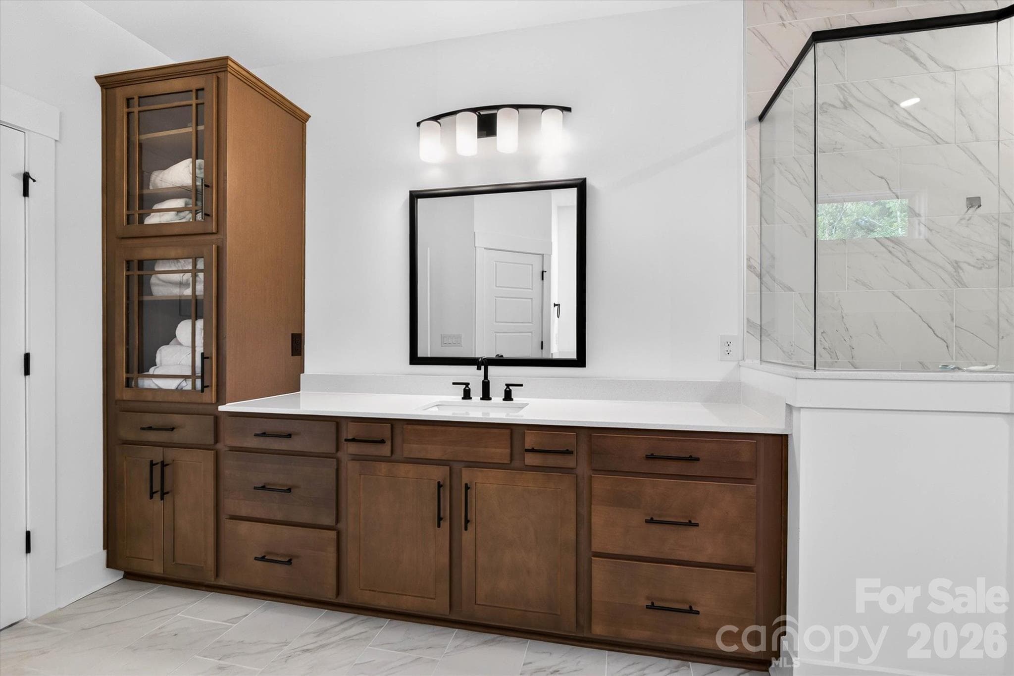 Storage that's beautiful. The built-in linen tower is the detail you won't notice until you love it. - 1216 Glade Arch Lane, Huntersville