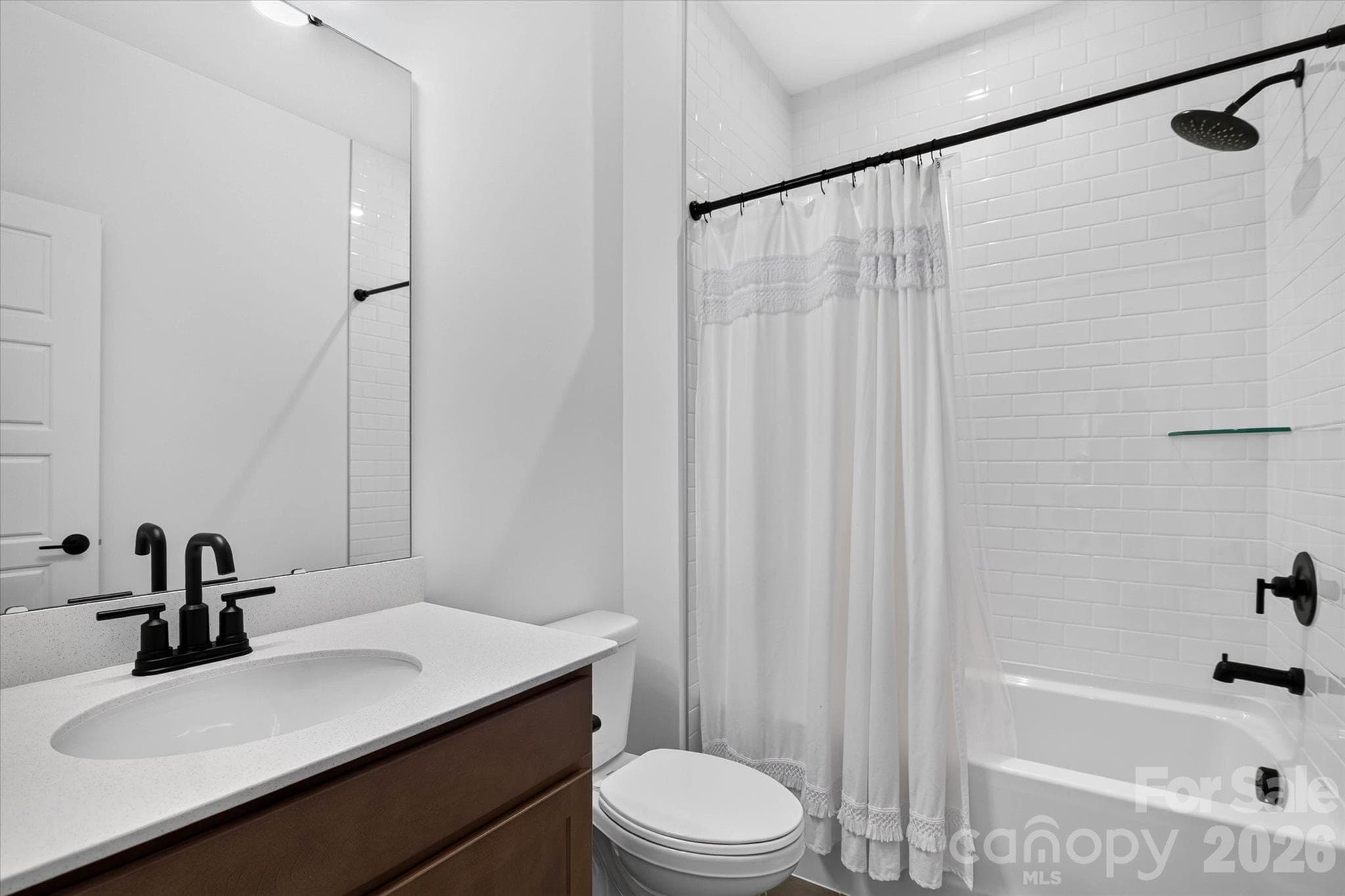 Clean, classic, and sharp. Every bathroom in this home was finished to the same standard, no afterthoughts here. - 1216 Glade Arch Lane, Huntersville
