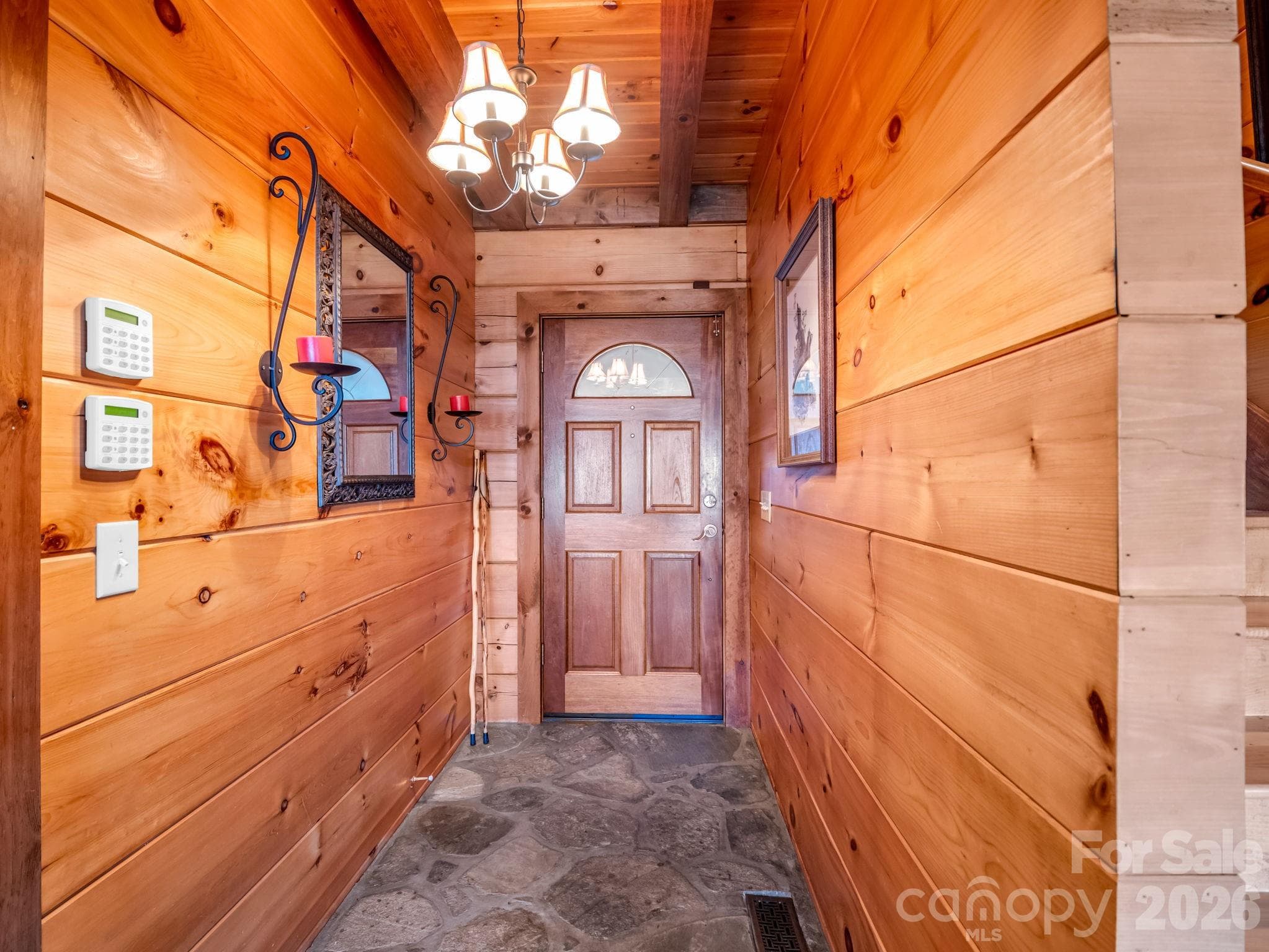 Warm wood walls and stone floor entry - 5409 Mineral Springs Mountain Avenue, Valdese