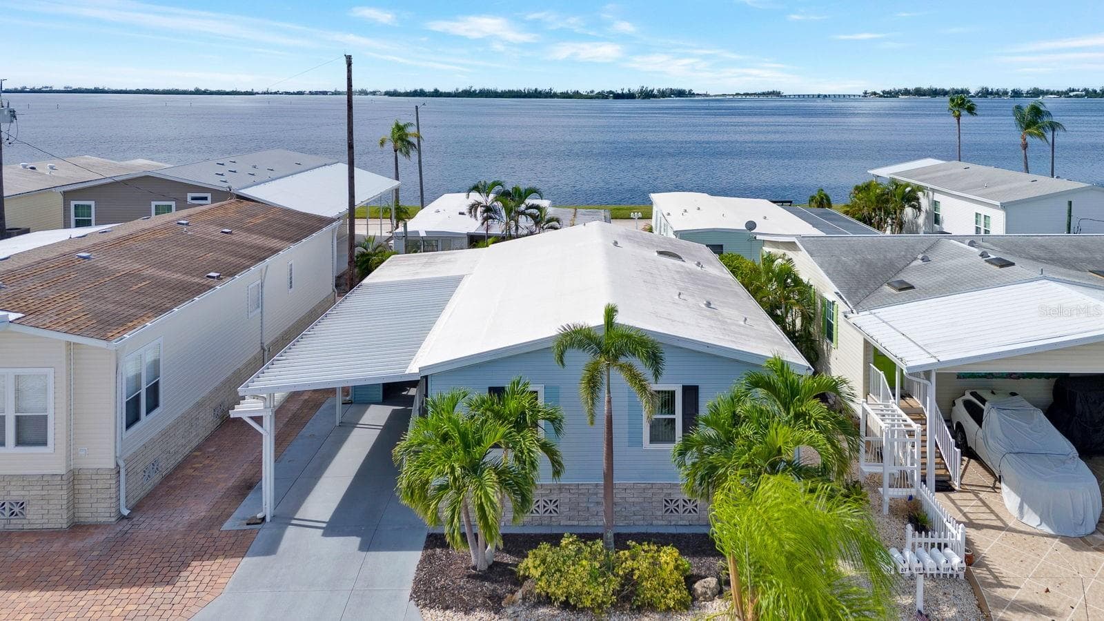 Front View with water bay behind it - 10315 CORTEZ RD W #7F, BRADENTON