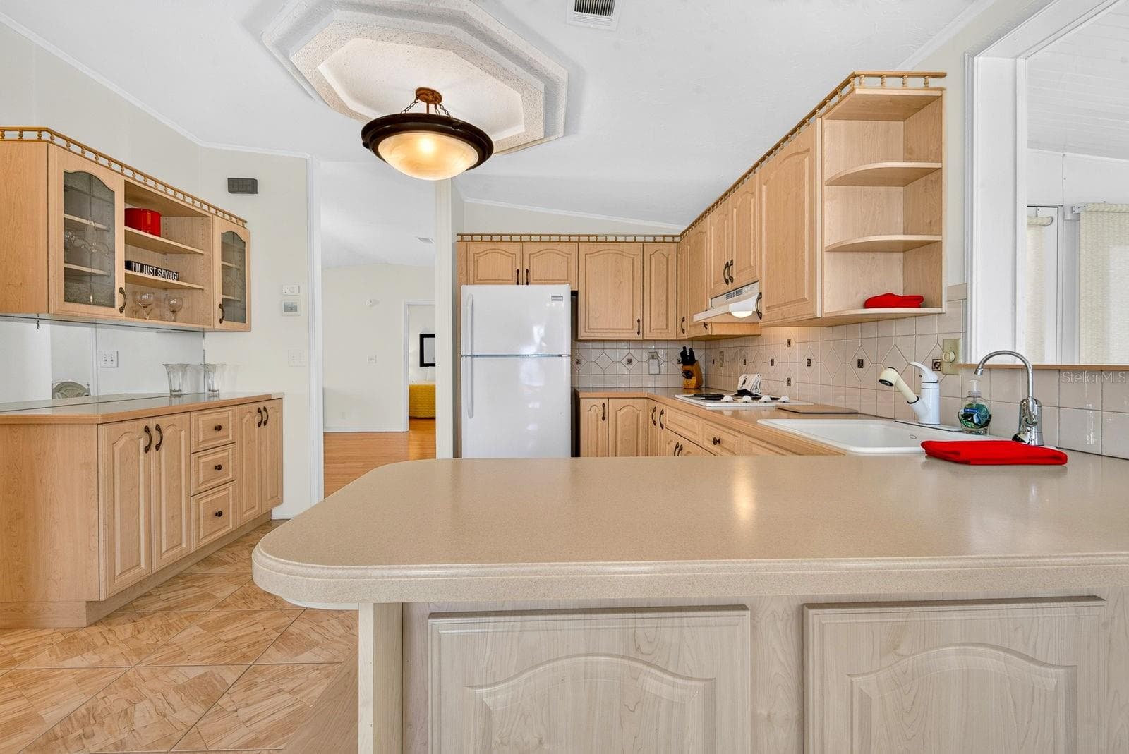 Large Kitchen area with lots of cabinets and counter space - 10315 CORTEZ RD W #7F, BRADENTON