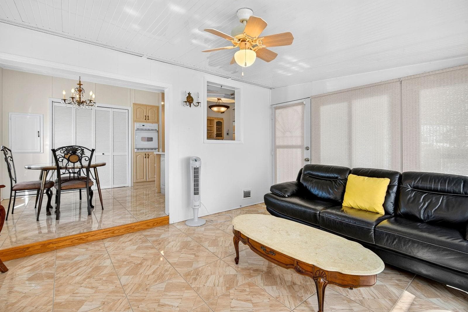 Enclosed Sunroom with breakfast area/kitchen behind it - 10315 CORTEZ RD W #7F, BRADENTON