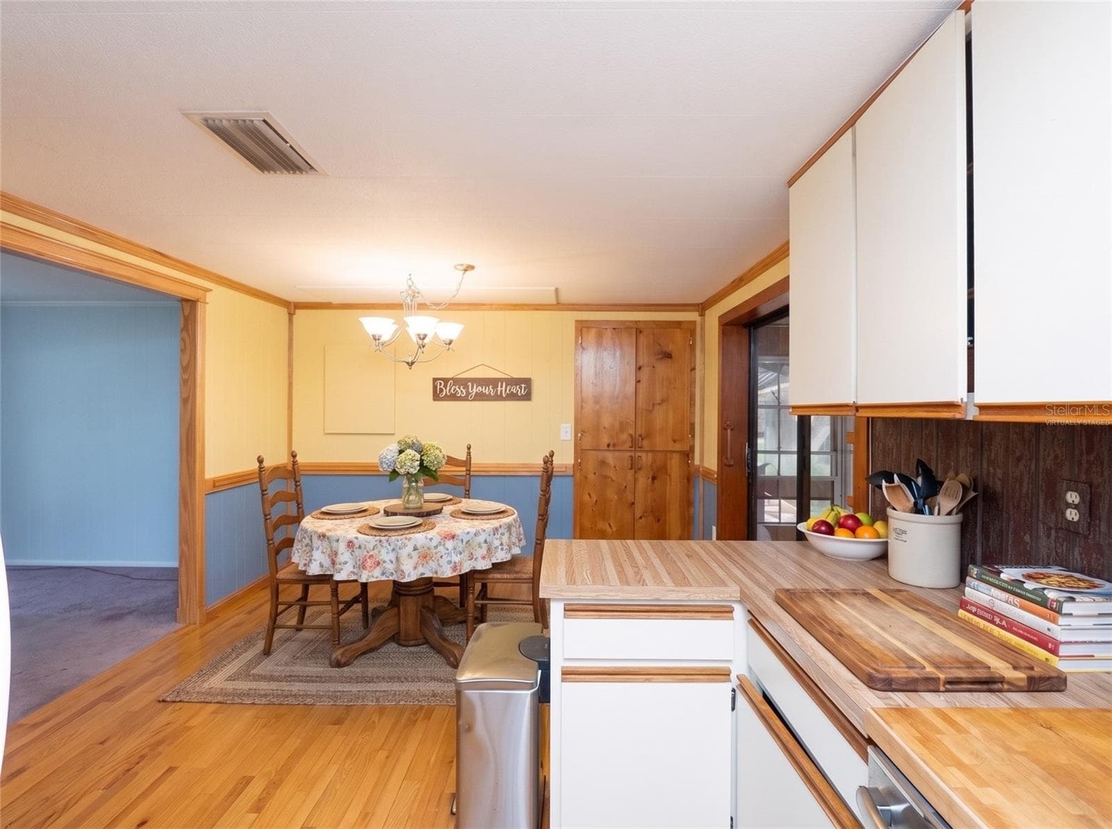 Kitchen View of Dining Room Virtually Staged - 6443 NE COUNTY ROAD 660, ARCADIA