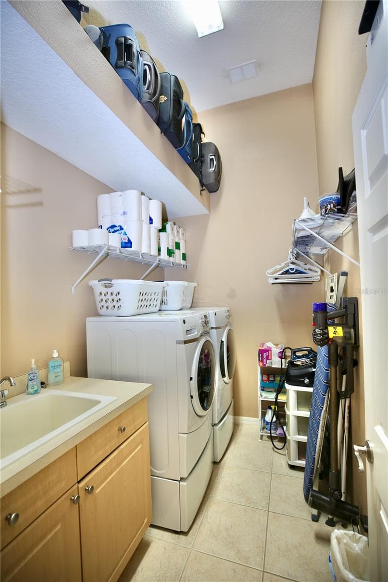 Laundry Room with so much extra space for storage and large tub sink. - 14824 TUDOR CHASE DR, TAMPA