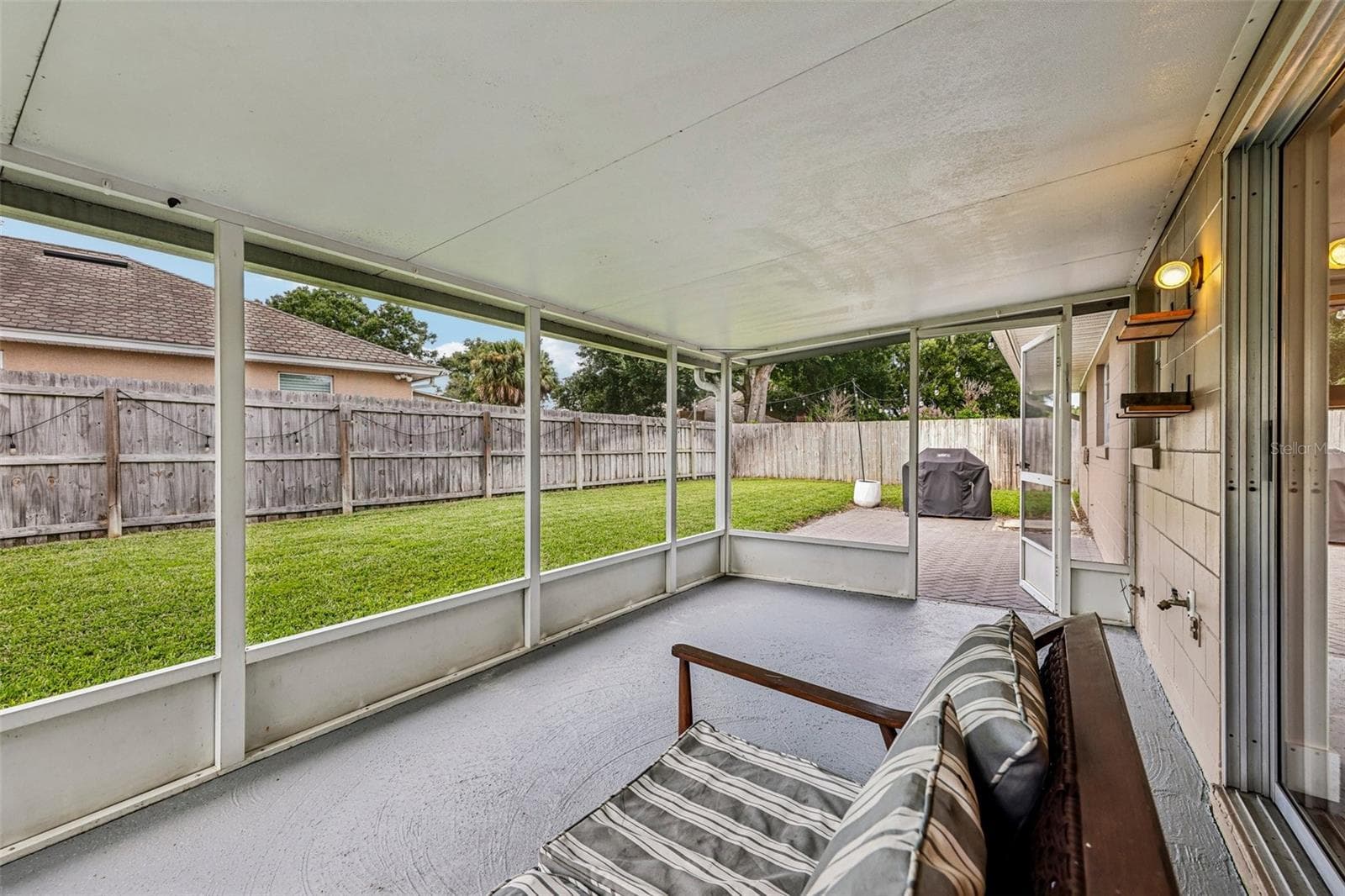 Back porch overlooking sizable back yard - 1519 GLASTONBERRY RD, MAITLAND