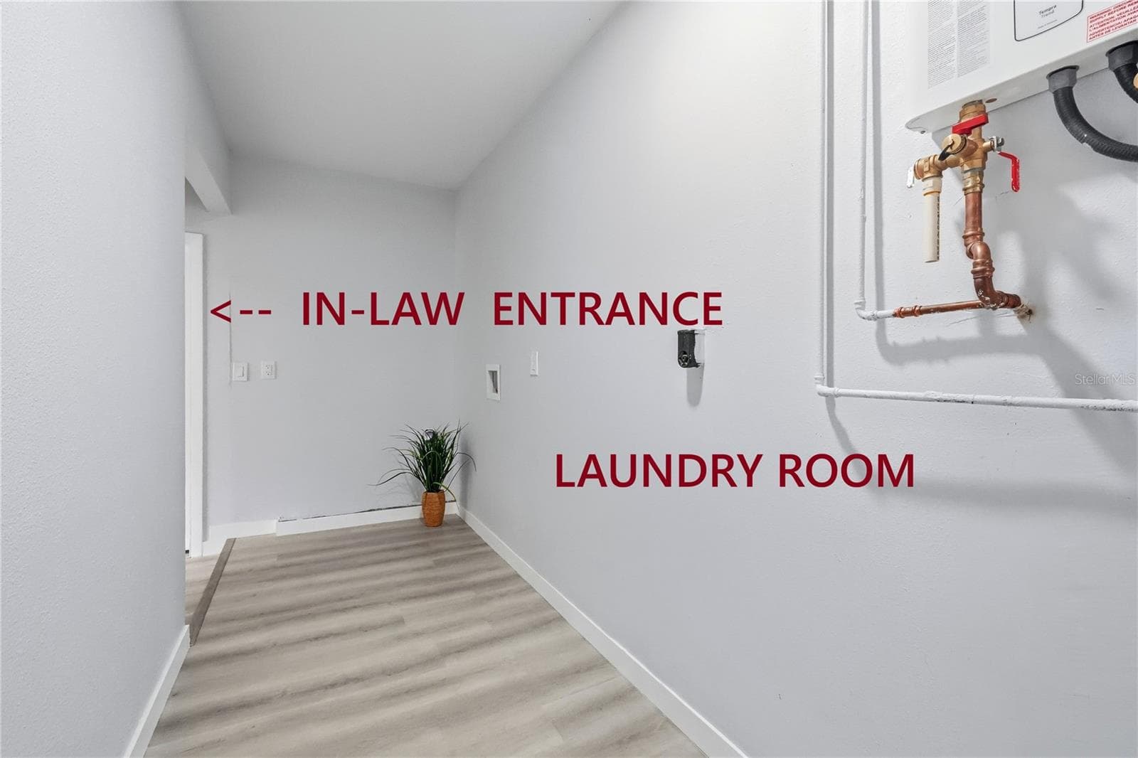 Laundry Room/Hall access to the In-Law Suite. - 1721 DORCHESTER RD, CLEARWATER