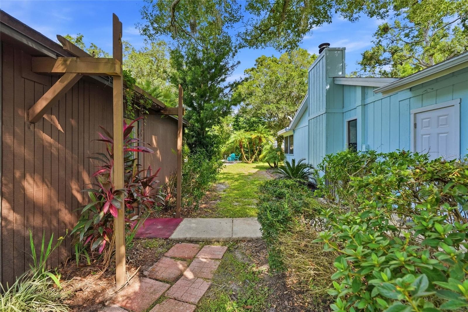 Short Walkway from the Garage to the In-Law/Side Entrance to the Home. - 1721 DORCHESTER RD, CLEARWATER