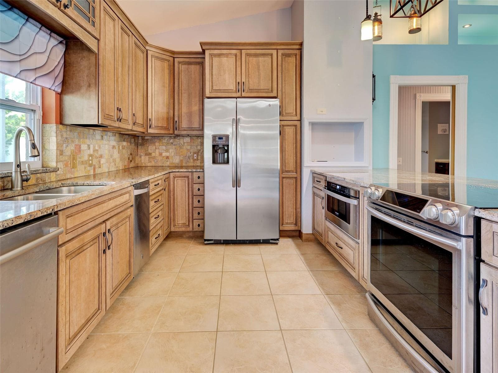 Accessible Kitchen with microwave next to the stove. - 23102 MADELYN AVE, PORT CHARLOTTE