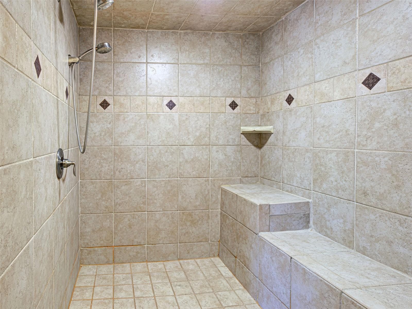 The primary shower is tastefully tiled and oversized. - 23102 MADELYN AVE, PORT CHARLOTTE