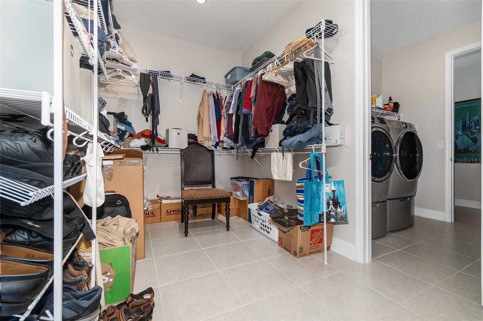 Huge Primary Bedroom Walk in Closet that connects to Laundry Room. Laundry Room connects to hallway with 2 other bedrooms and a bath - 13557 PARKFIELD WAY, WINTER GARDEN