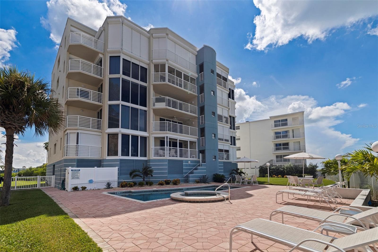 Rear building patio and pool view - 19616 GULF BLVD #302, INDIAN SHORES