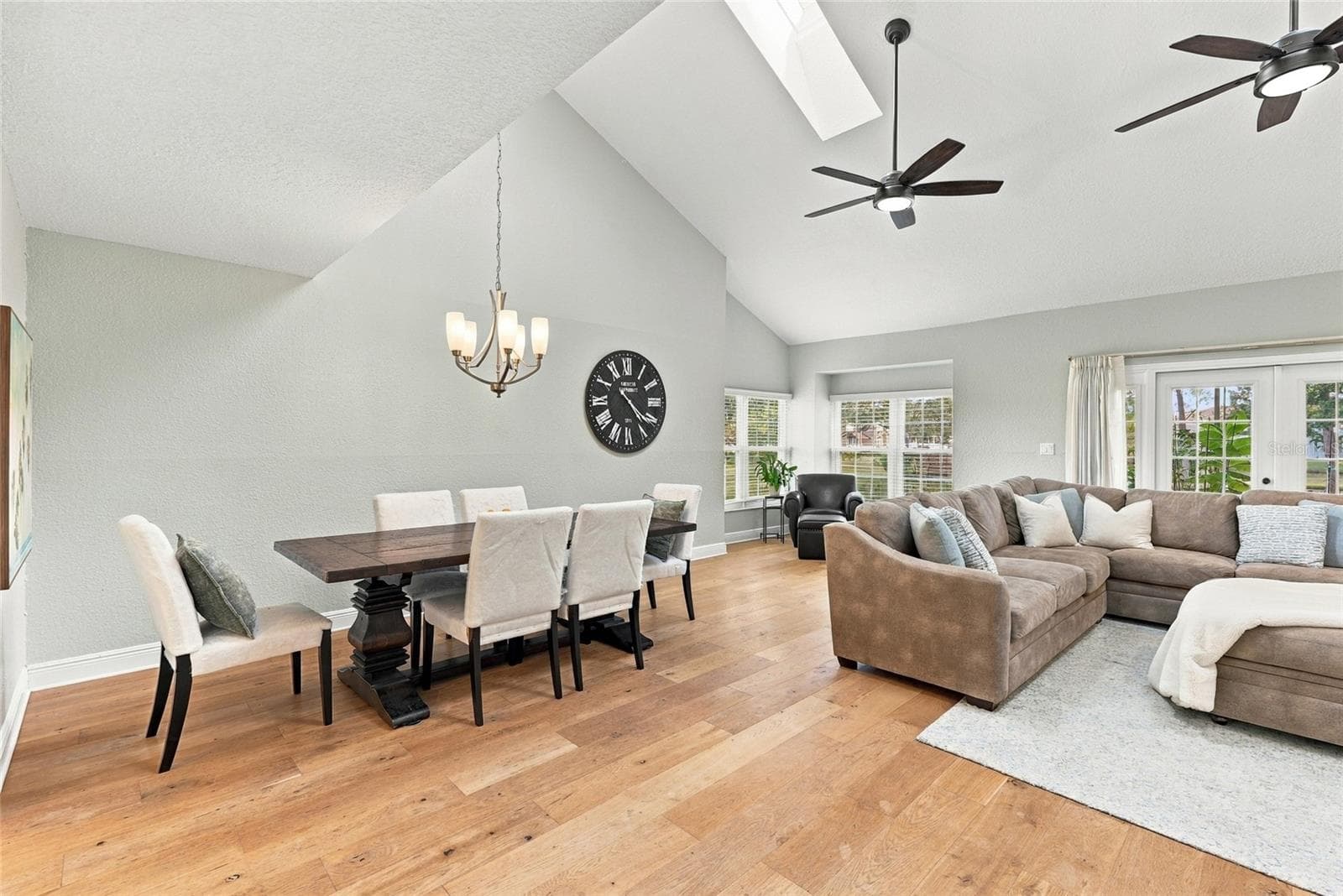 Bright, inviting dining space with hardwood floors and an easy flow for entertaining. - 629 SEGOVIA CT NE #405, ST PETERSBURG