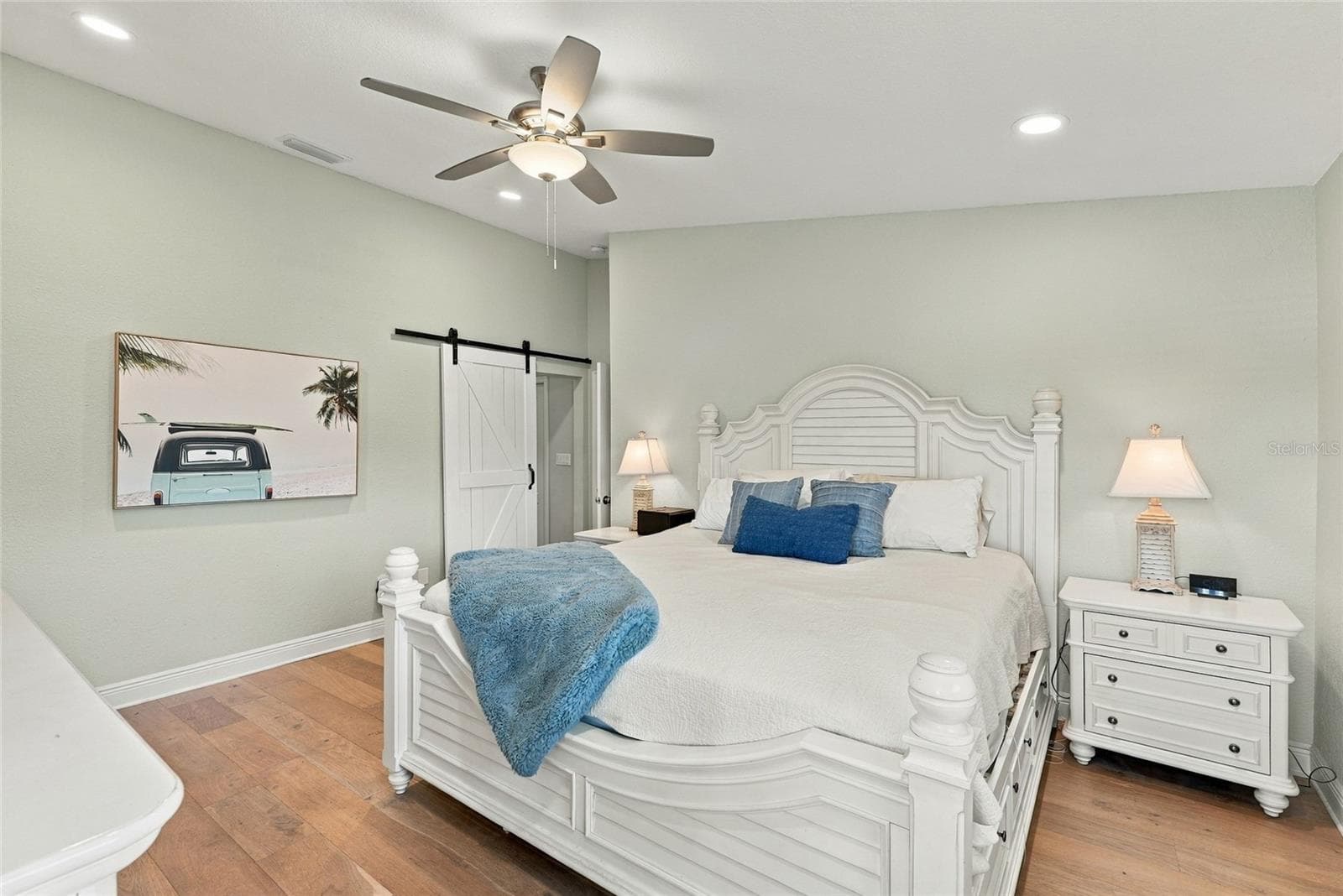 Spacious primary retreat with beautiful hardwood floors, abundant natural light, and a peaceful atmosphere. - 629 SEGOVIA CT NE #405, ST PETERSBURG