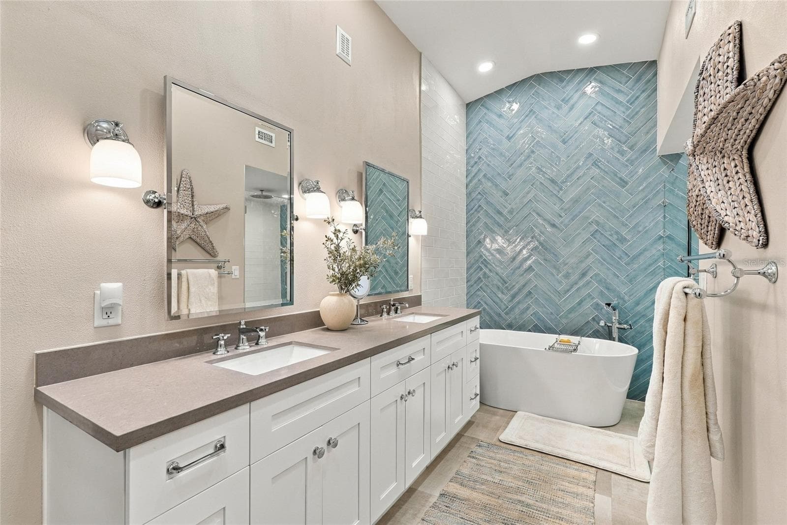 Beautifully updated primary bath featuring a freestanding soaking tub and elegant modern finishes. - 629 SEGOVIA CT NE #405, ST PETERSBURG