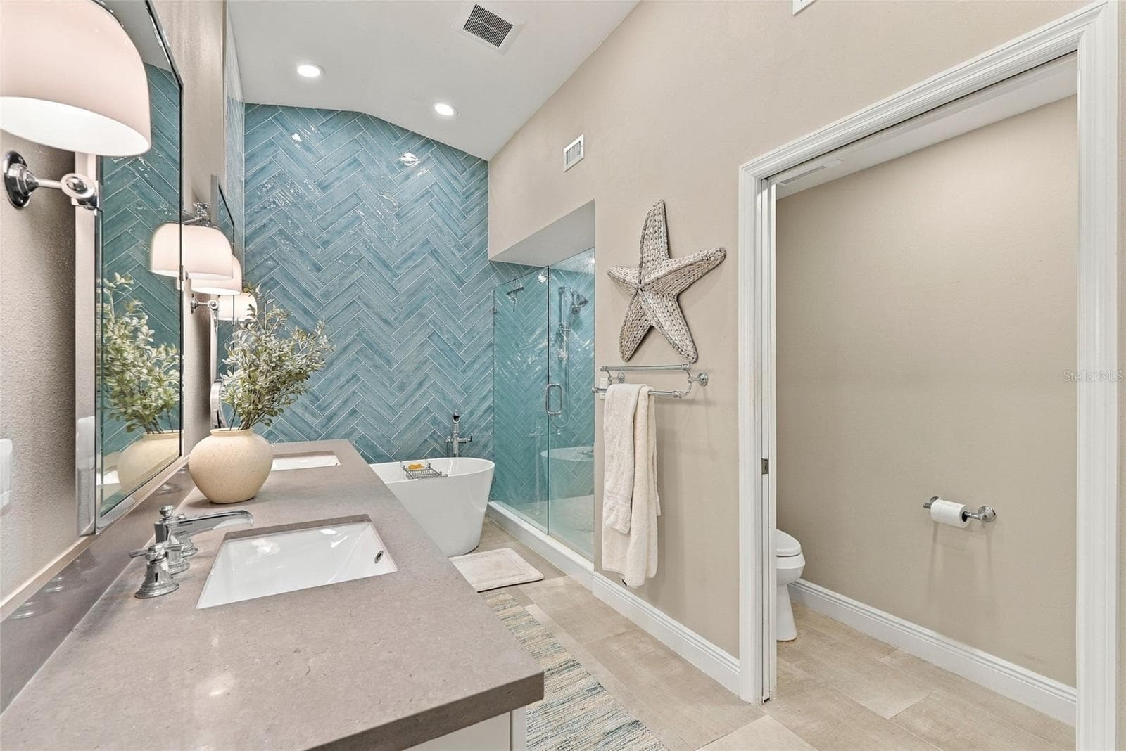 Quartz double vanity with soft-close shaker cabinetry offers plenty of space and storage for everyday living. - 629 SEGOVIA CT NE #405, ST PETERSBURG