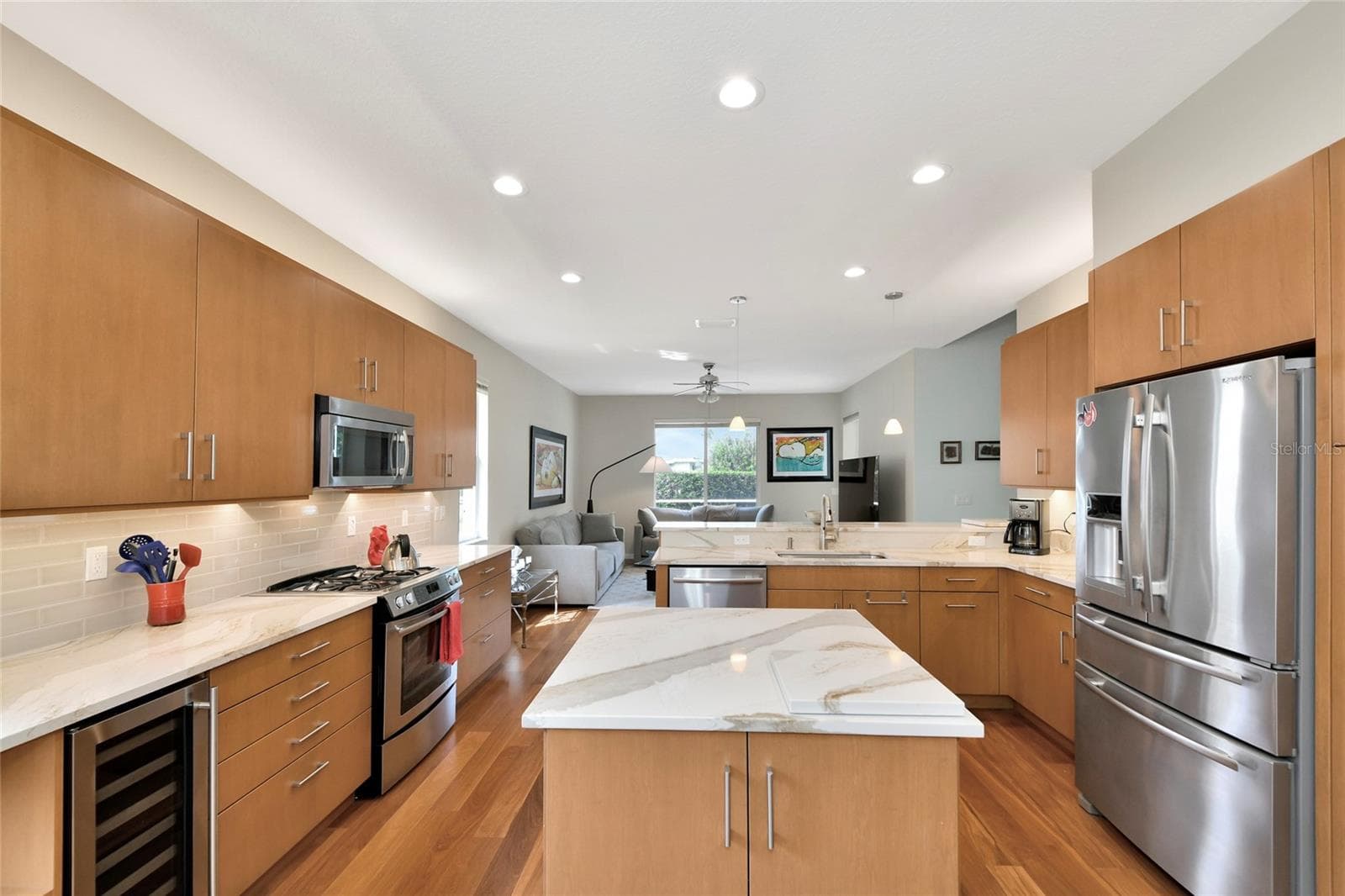Island kitchen, quartzite counters, wine refrigerator, & Jen-Aire stainless appliances. - 6256 DONNINGTON CT, SARASOTA
