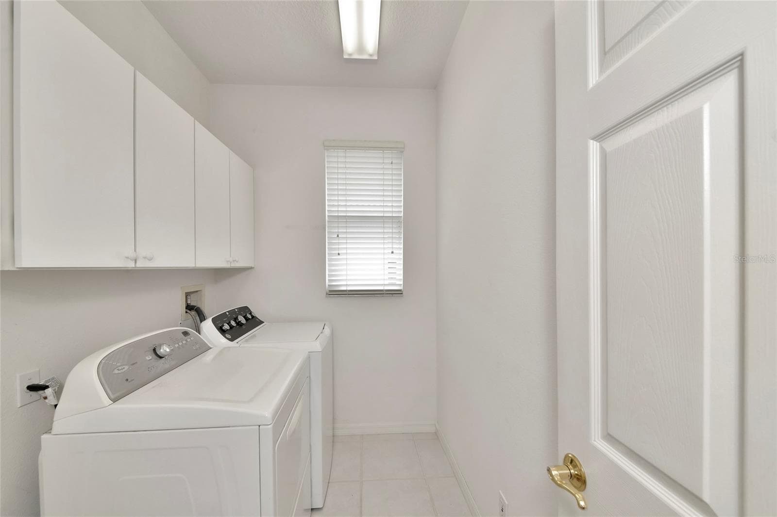 Inside laundry, natural gas dryer, not shown utility sink. - 6256 DONNINGTON CT, SARASOTA