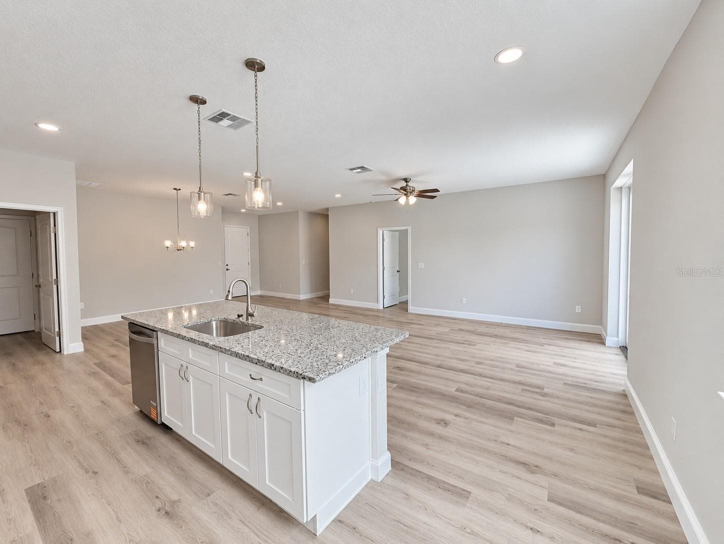 Kitchen island standing behind island model - 21521 SW MARINE BLVD, DUNNELLON