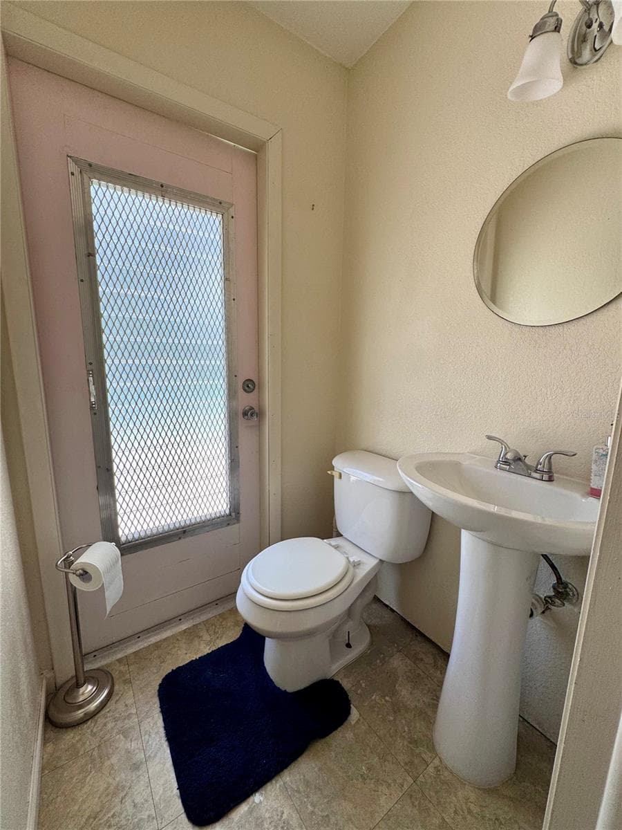 Pool access 1/2 bath - 22215 ONEIDA AVE, PORT CHARLOTTE