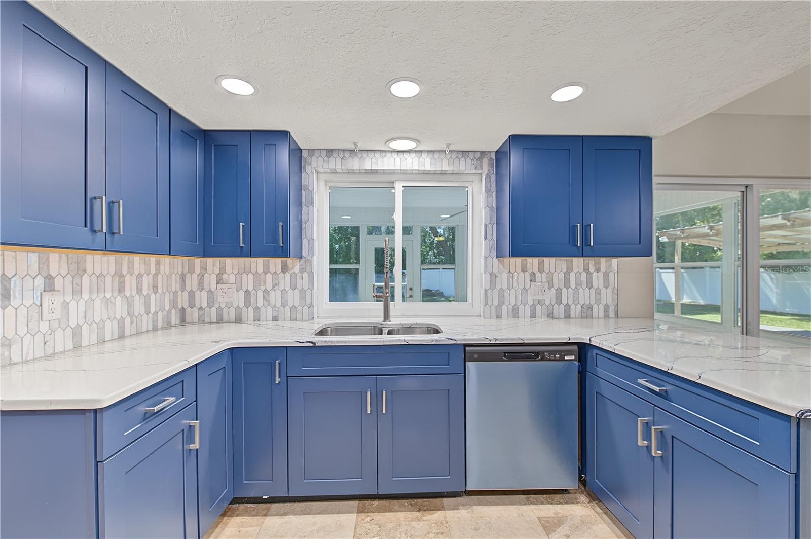 Spacious kitchen featuring abundant cabinetry, generous counter space, and an inviting central layout. - 260 SE 16TH TER, CRYSTAL RIVER