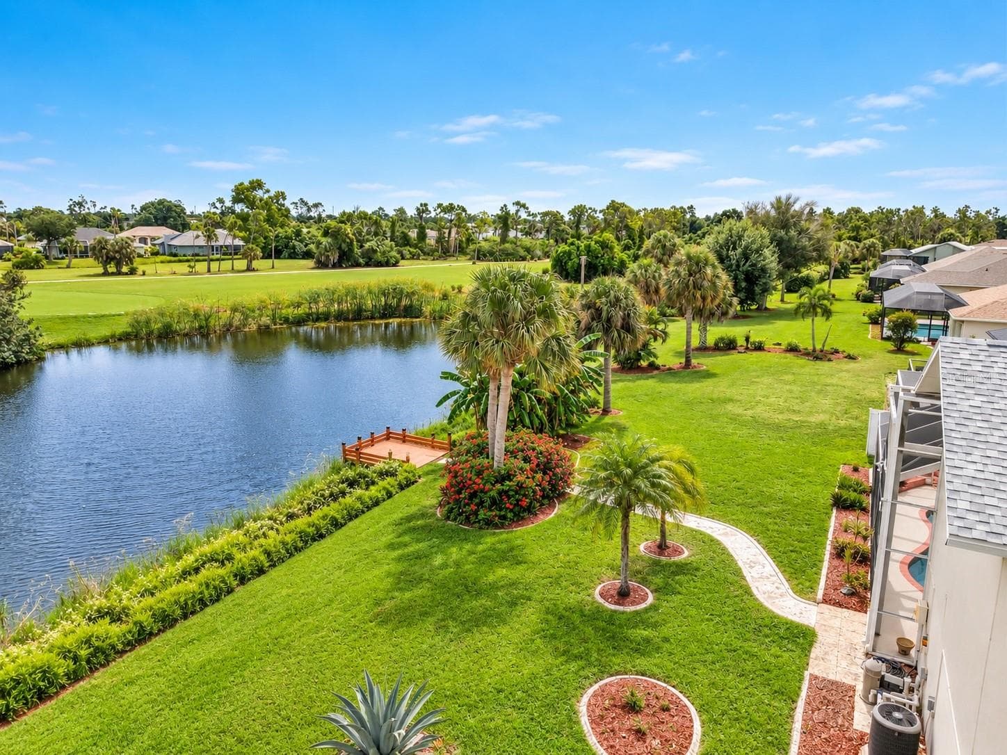 6. Pond views and landscaped backyard. - 63 CLUBHOUSE RD, ROTONDA WEST