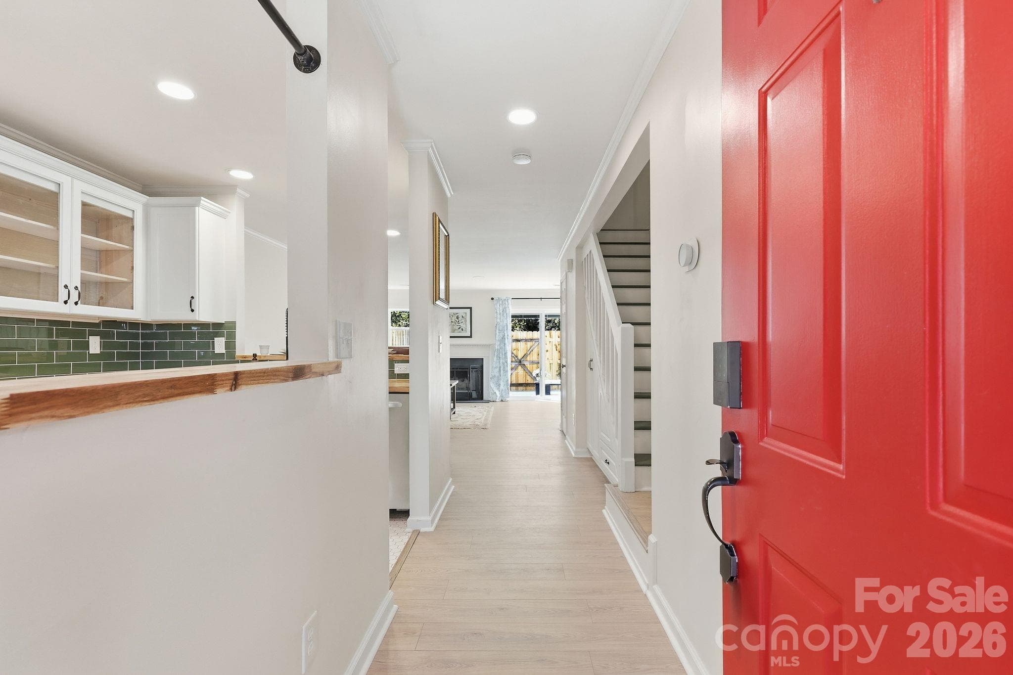 Welcome home to a cheerful red front door and covered porch with room to sit and relax. - 3858 Mosscroft Lane, Charlotte