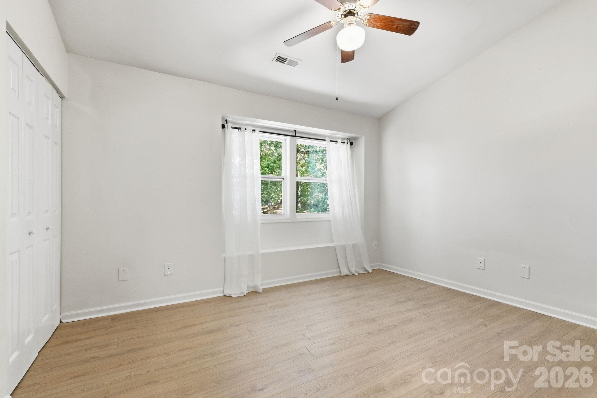 A comfortable bedroom ready to become your personal retreat. - 3858 Mosscroft Lane, Charlotte
