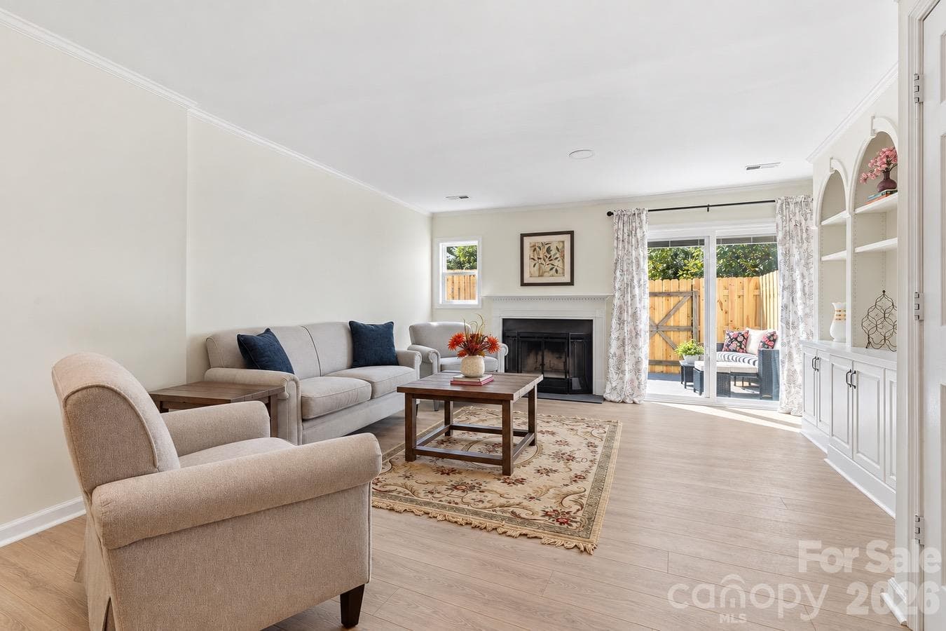 A comfortable patio seating area offers a welcoming spot for morning coffee or an evening outdoors. - 3858 Mosscroft Lane, Charlotte