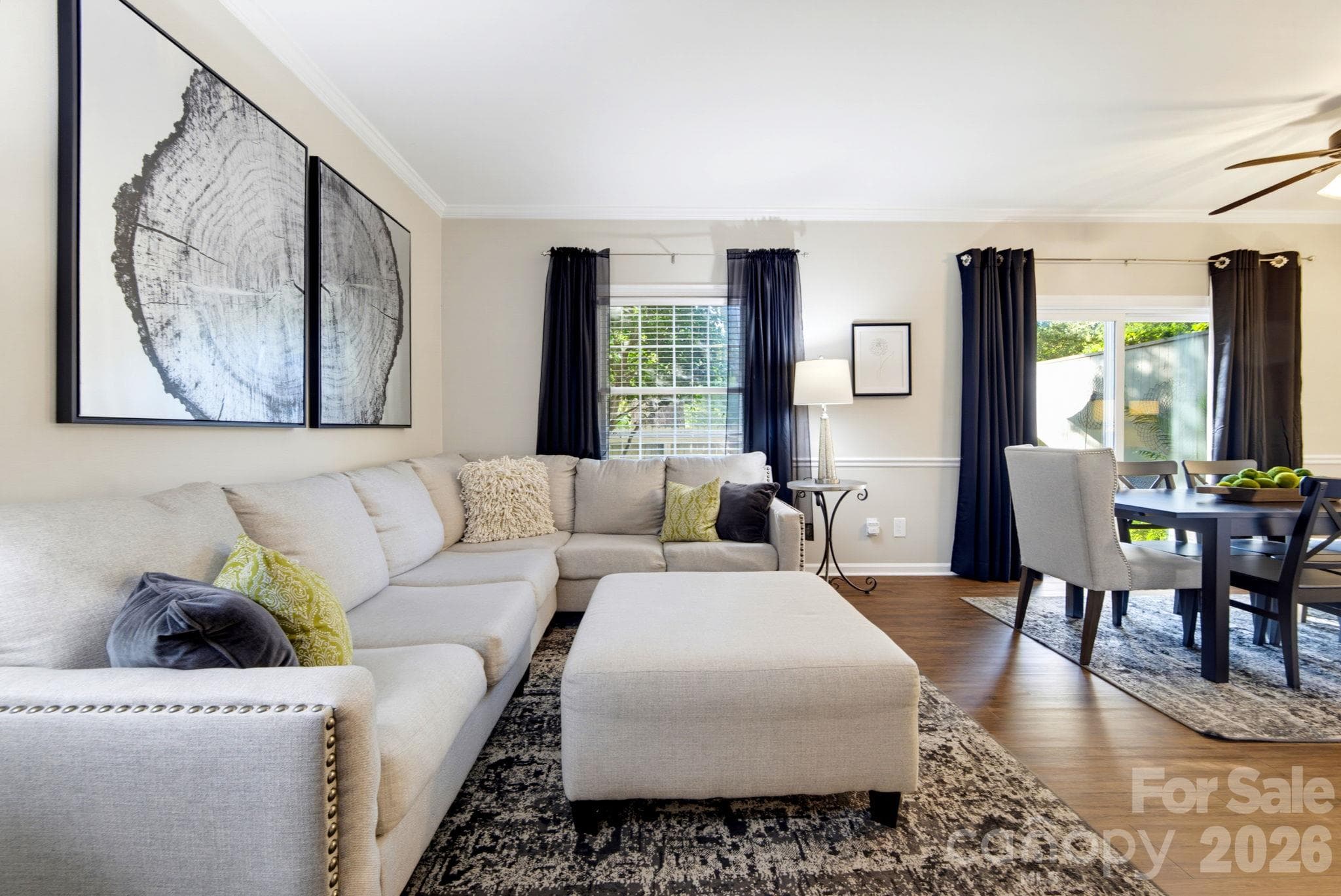 Another view highlighting the natural connection between the living and dining areas while maintaining two distinct spaces. - 5901 Quail Hollow Road, Charlotte