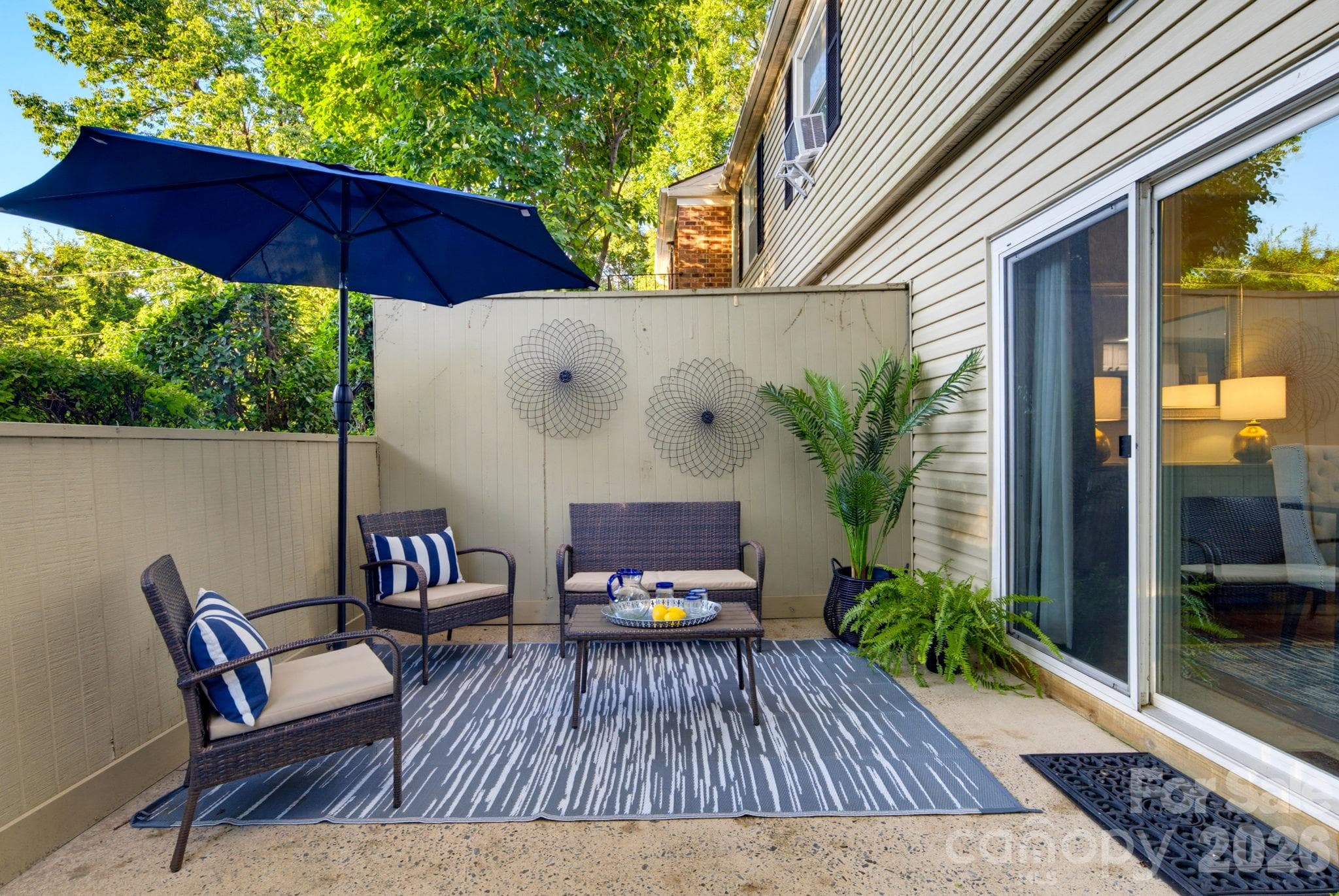 Just steps from the dining area, enjoy  outdoor living and entertaining in your private patio. - 5901 Quail Hollow Road, Charlotte