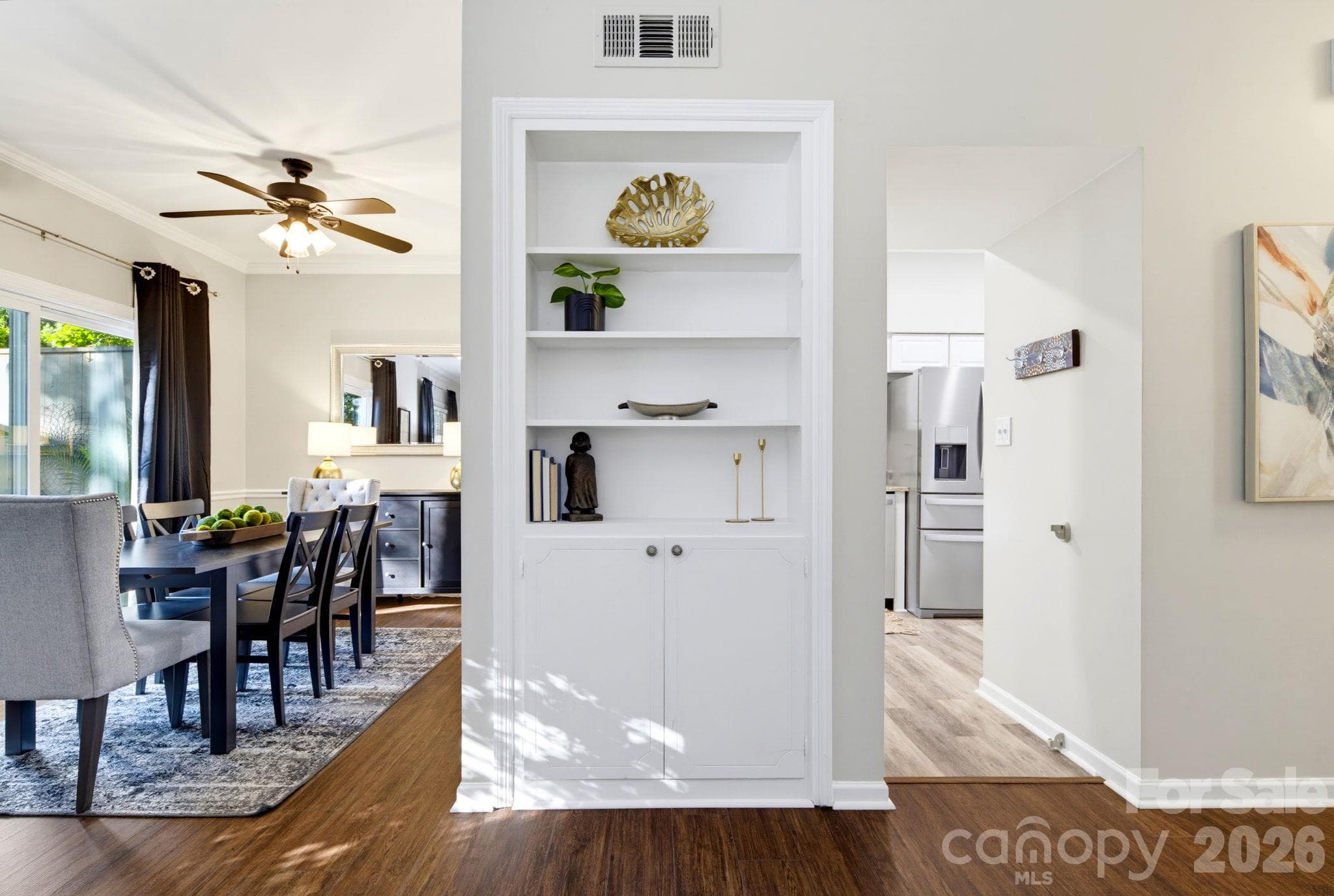 An abundance of natural light, easy flow between the living, dining and kitchen areas, with built-in shelving and storage. - 5901 Quail Hollow Road, Charlotte