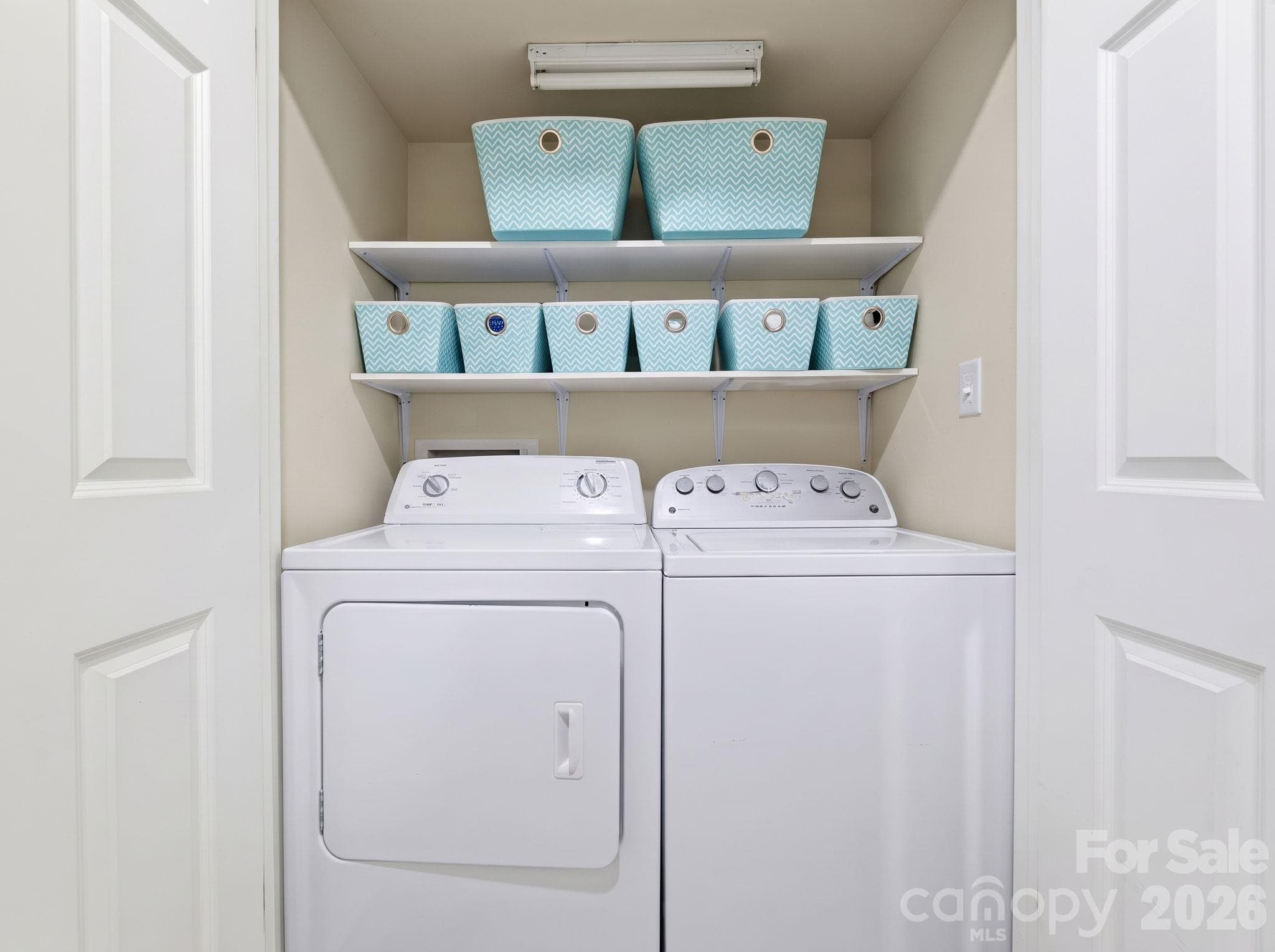 Full-size enclosed laundry area, with added shelving for storage - 5901 Quail Hollow Road, Charlotte